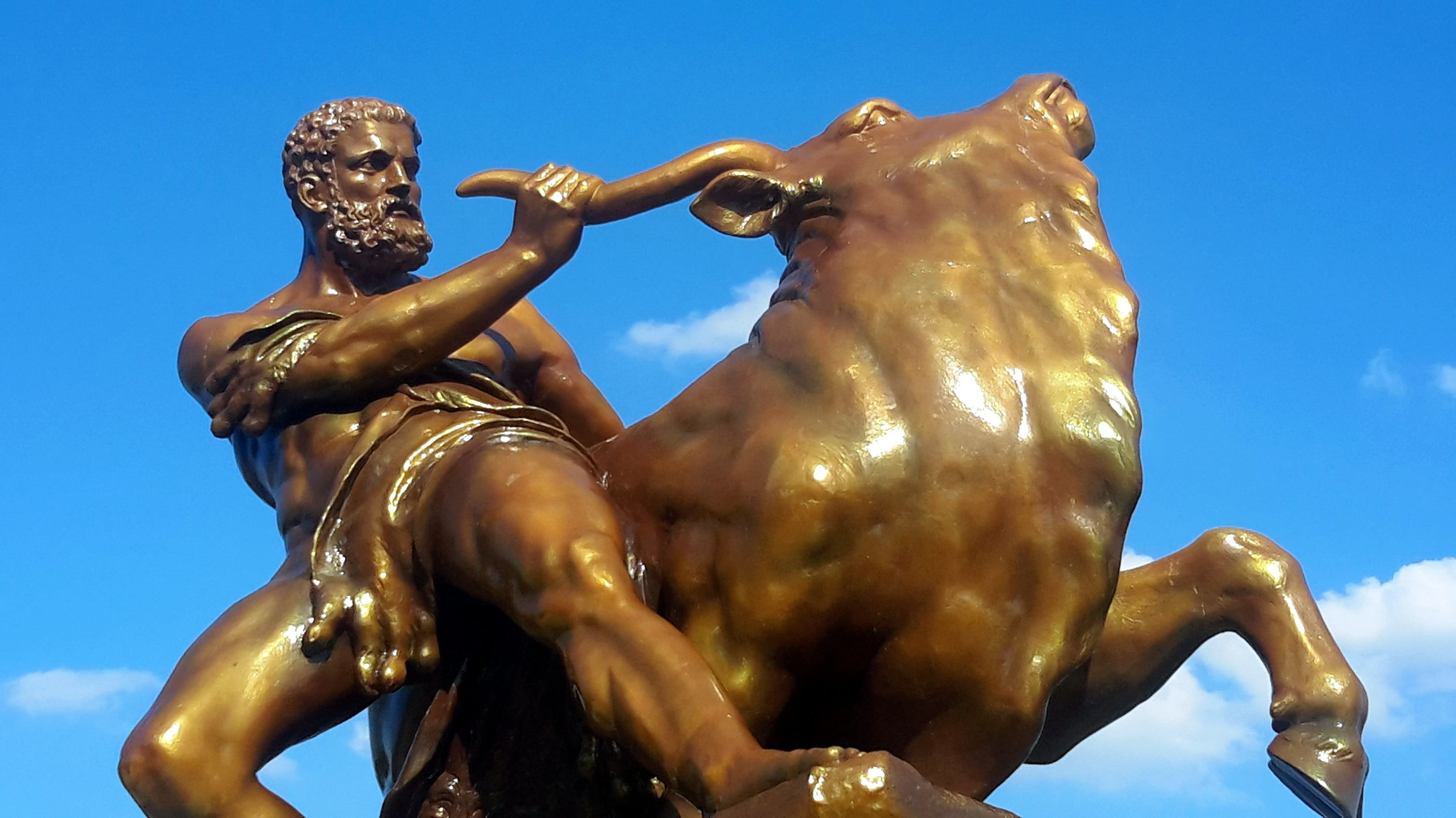 figure, representation, water, art and craft, creativity, heracles, sky, day, 2K, artwork, bull, riding, gold, human representation, strength, gold colored, HD Wallpaper
