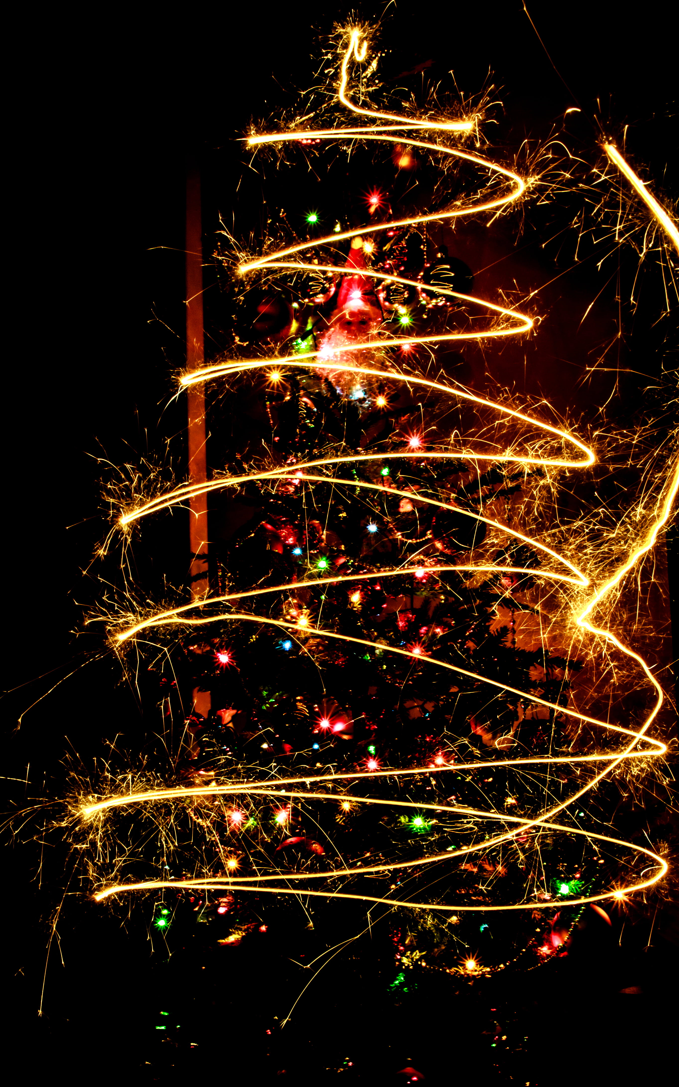 illuminated, holiday - event, bright, christmas, low angle view, sparks, yellow, fire - Natural Phenomenon, celebrate, sparkler, arts culture and entertainment, Phone HD Wallpaper