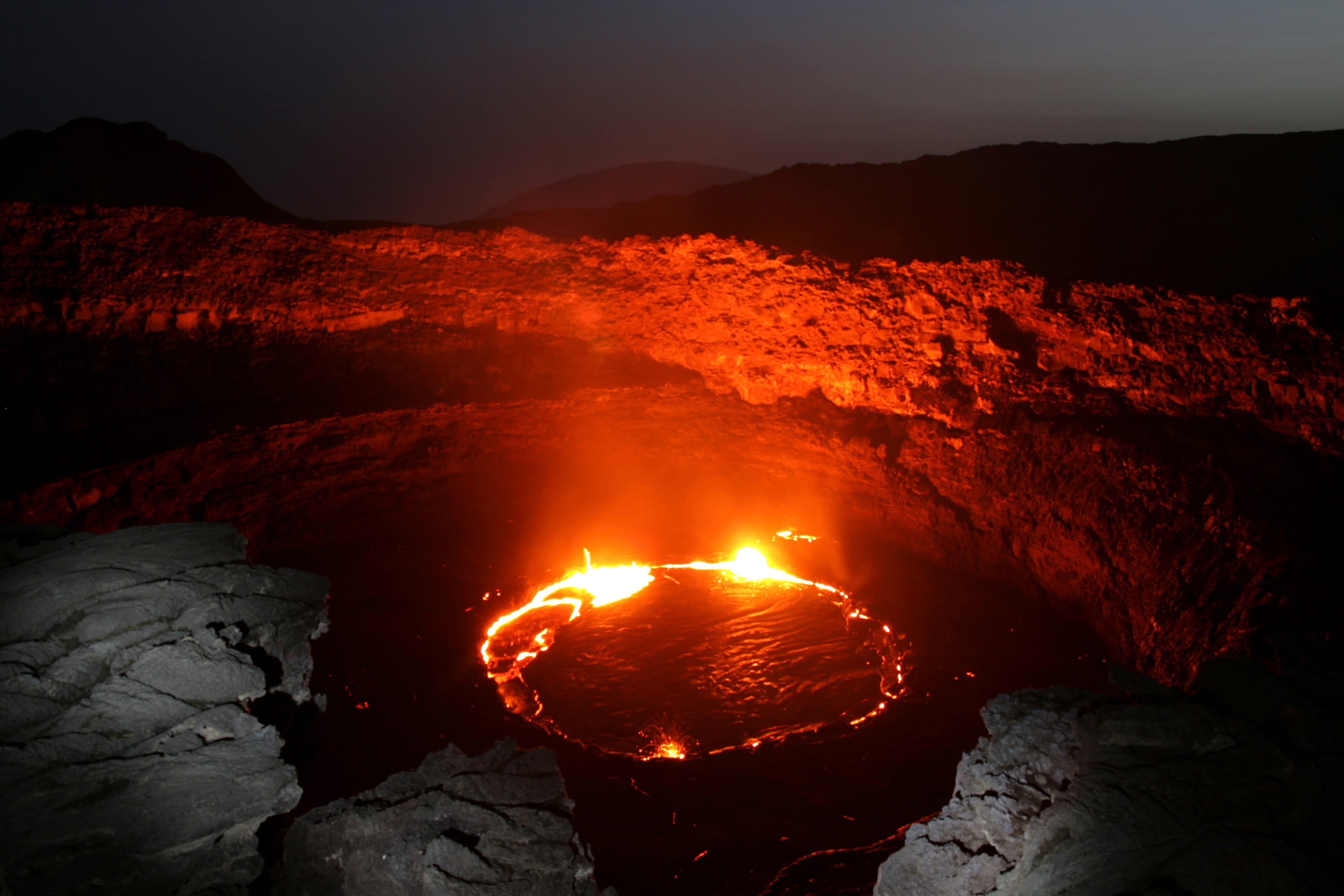 solid, outdoors, cliff, evening, land, water, power, nature, volcanic crater, luminosity, molten, burning, mountain, flowing, rock - object, no people, HD Wallpaper