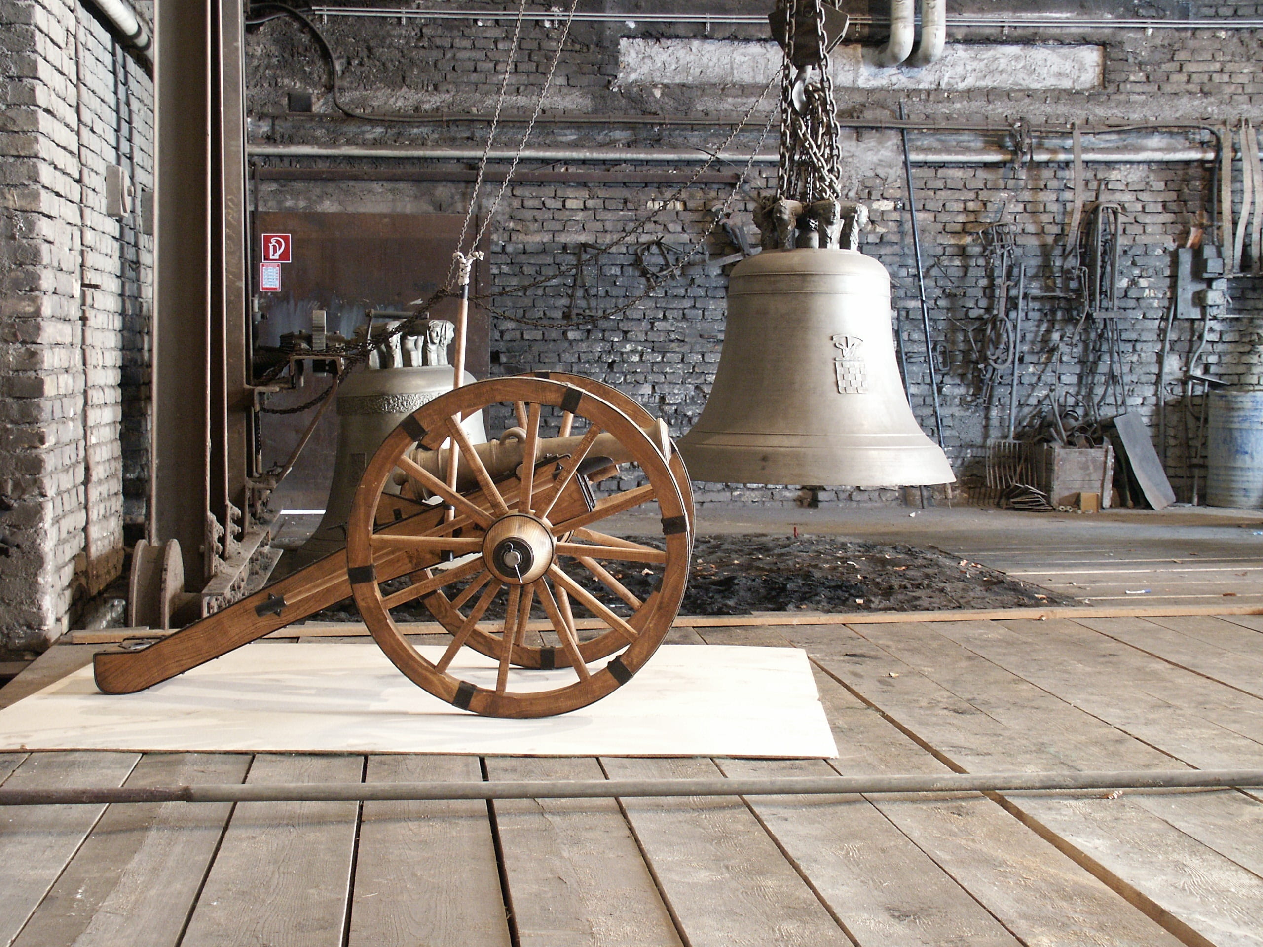 no people, wood - material, industry, outdoors, history, old, bell, wagon wheel, day, foundry, metal, wall - building feature, 2K, shape, architecture, HD Wallpaper