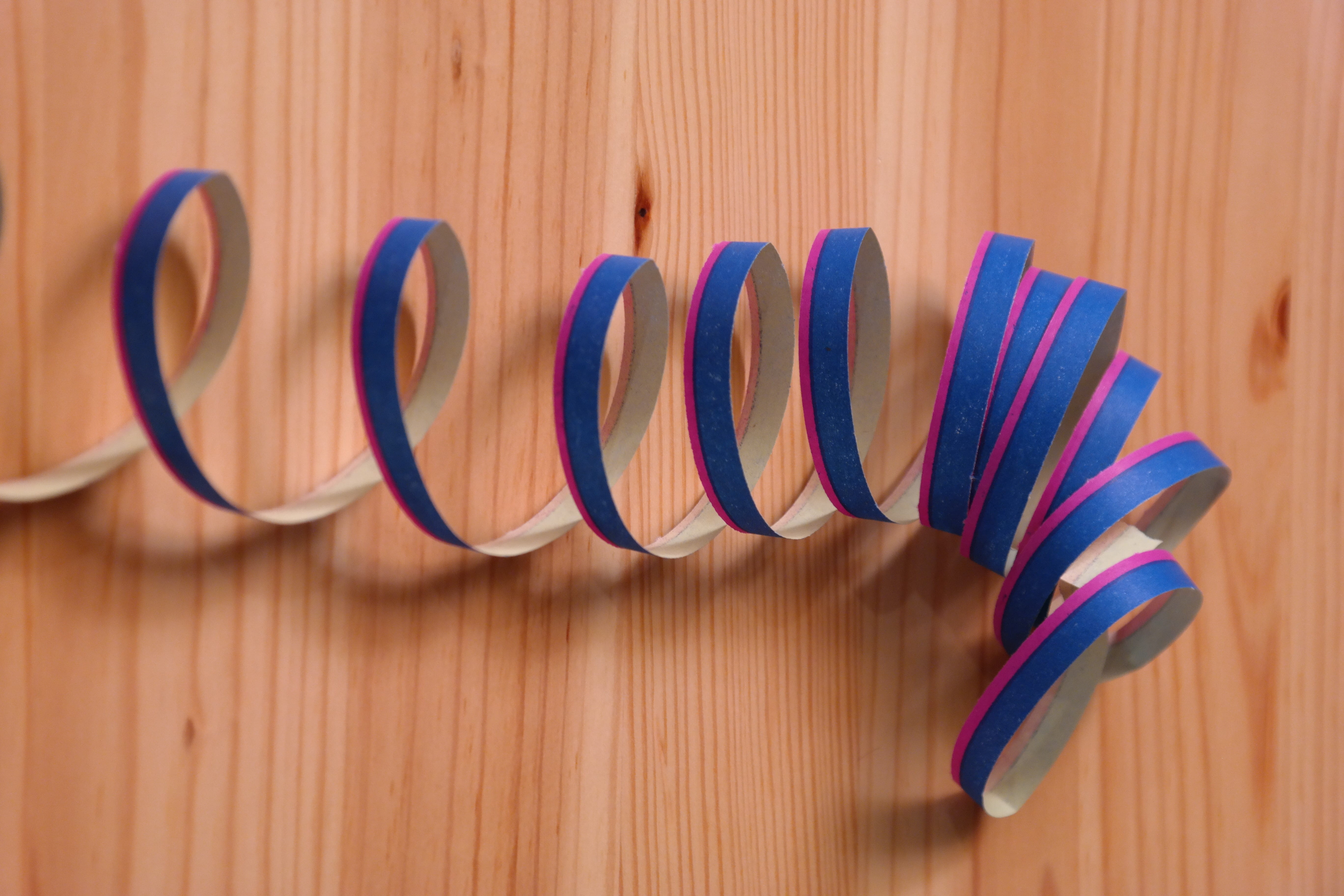 indoors, wood grain, western script, order, blue, wood, multi colored, party, paper snakes, in a row, technology, ringed, no people, fasnet, copy space, HD Wallpaper