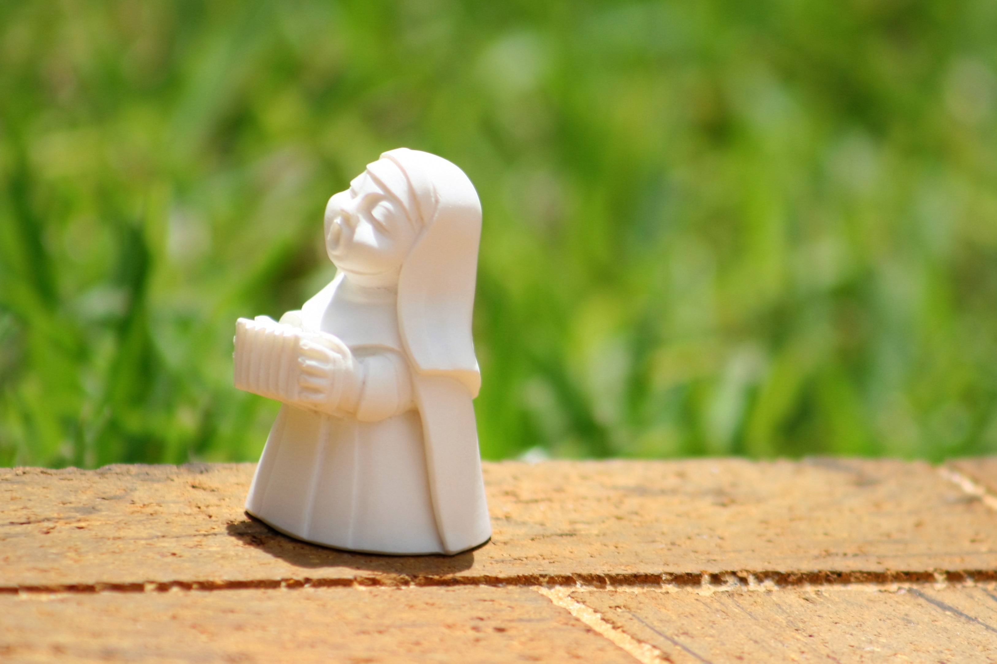 playing the accordion nun, singing nun, sculpture, small, sunlight, figurine, 2K, nature, statue, art and craft, single object, playing nun, representation, HD Wallpaper