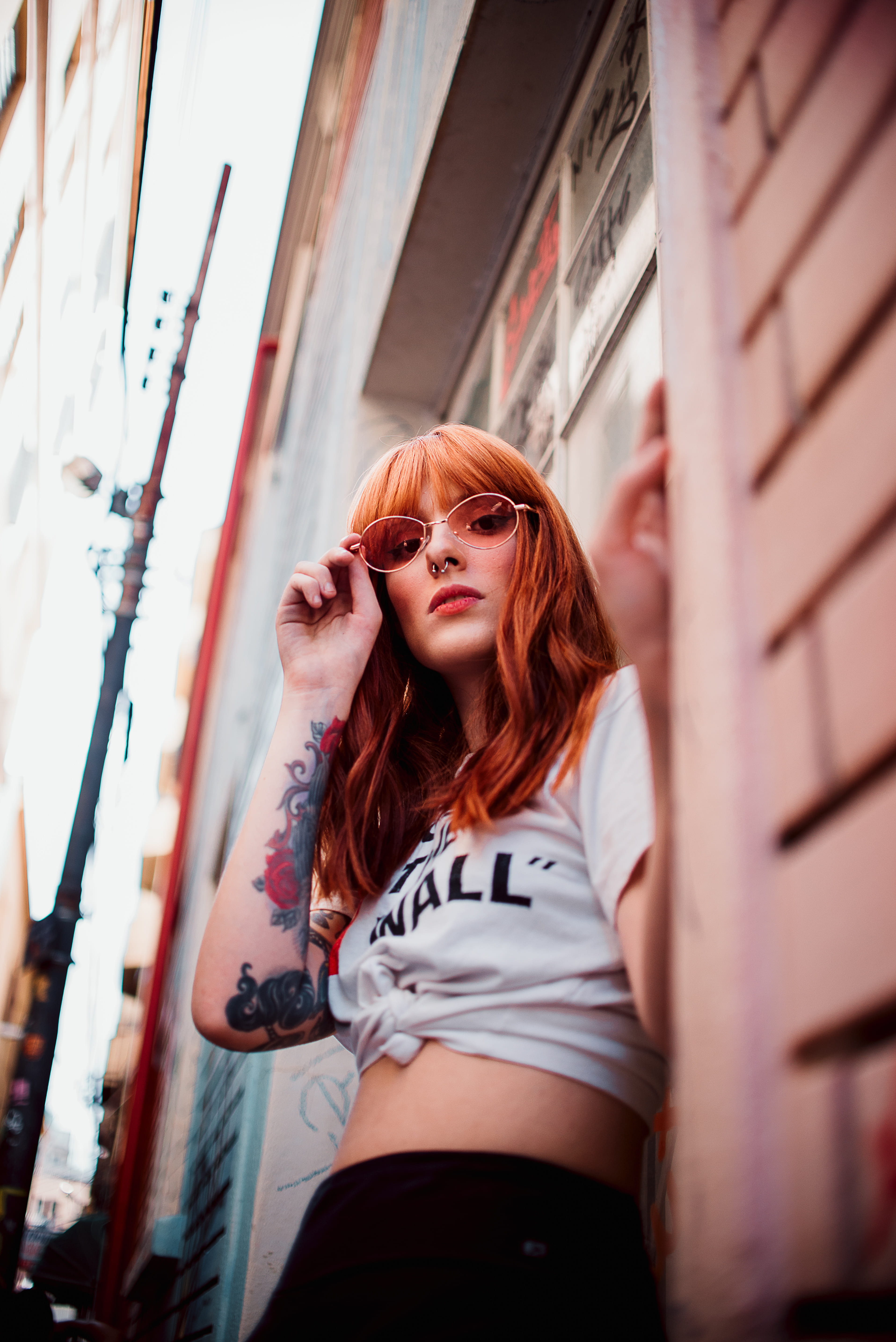 female, day, low angle photography, tattooed, adult, women, low angle shot, looking, wear, sunglasses, pretty, beautiful woman, three quarter length, person, Phone HD Wallpaper