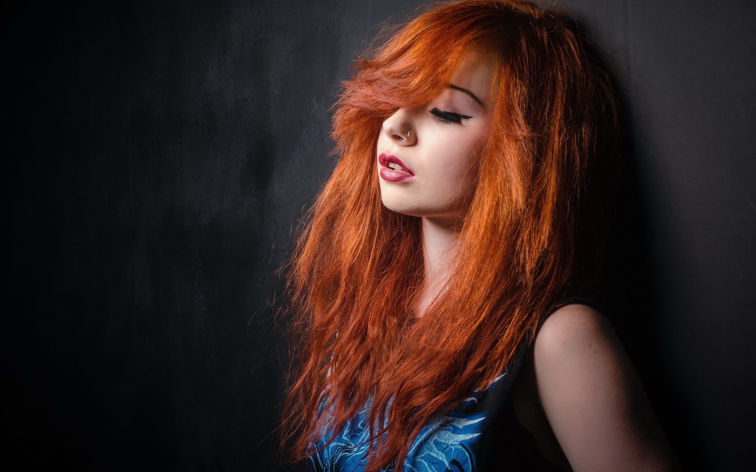 nose rings, 2K, redhead, face, lips, Ariel Rebel, women, simple background, model, eyes, long hair, pierced nose, closed eyes, blue clothes, HD Wallpaper