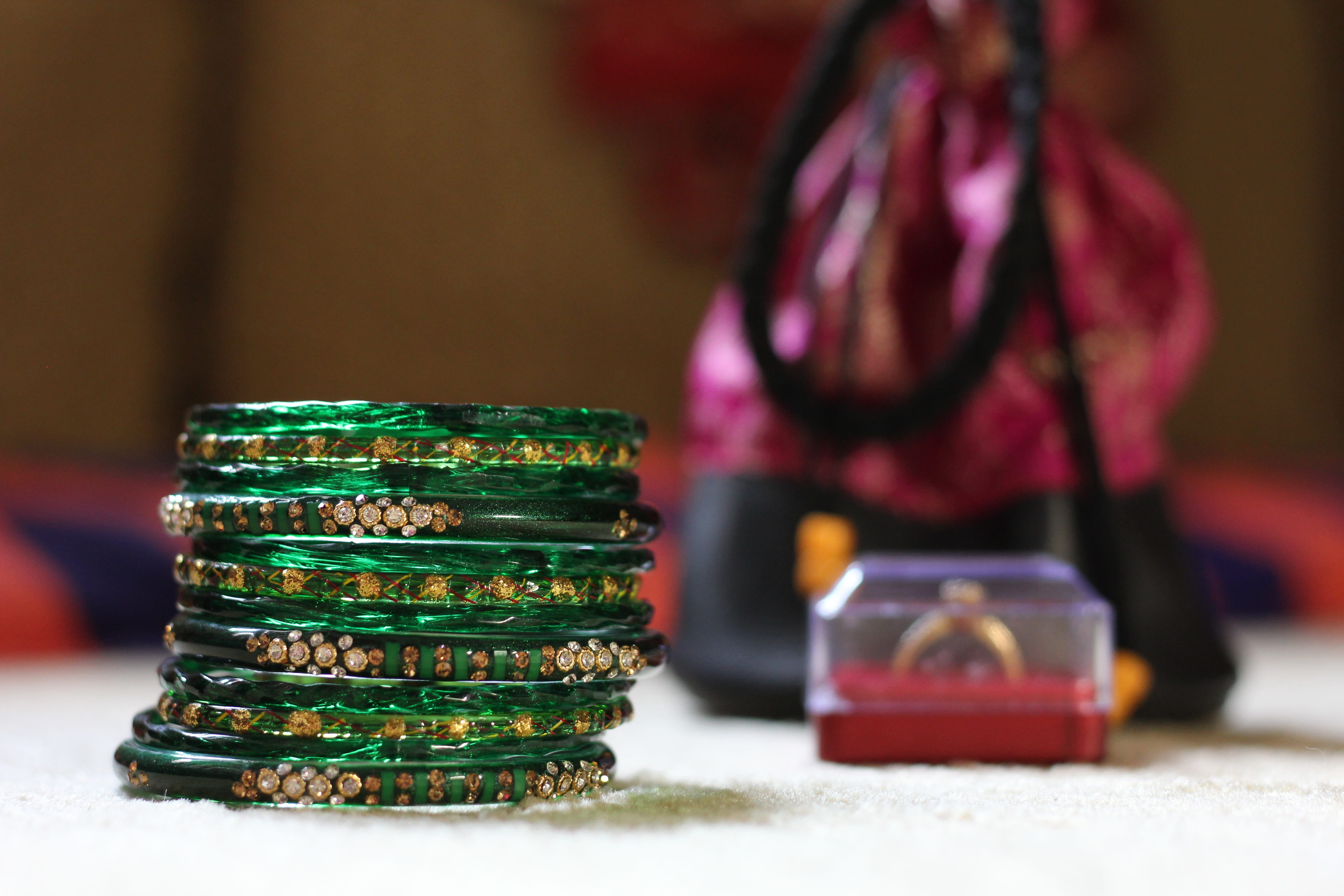 arts culture and entertainment, bracelets, green, playing, close-up, finance, focus on foreground, standing, table, 5K, glass, bangels, leisure activity, HD Wallpaper