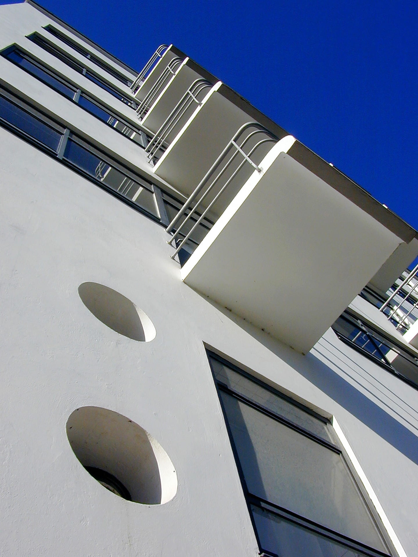 outdoors, blue, built structure, silver colored, balcony, architecture, city, building, 1080P, low angle view, clear sky, day, window, tilt, studio building, Phone HD Wallpaper