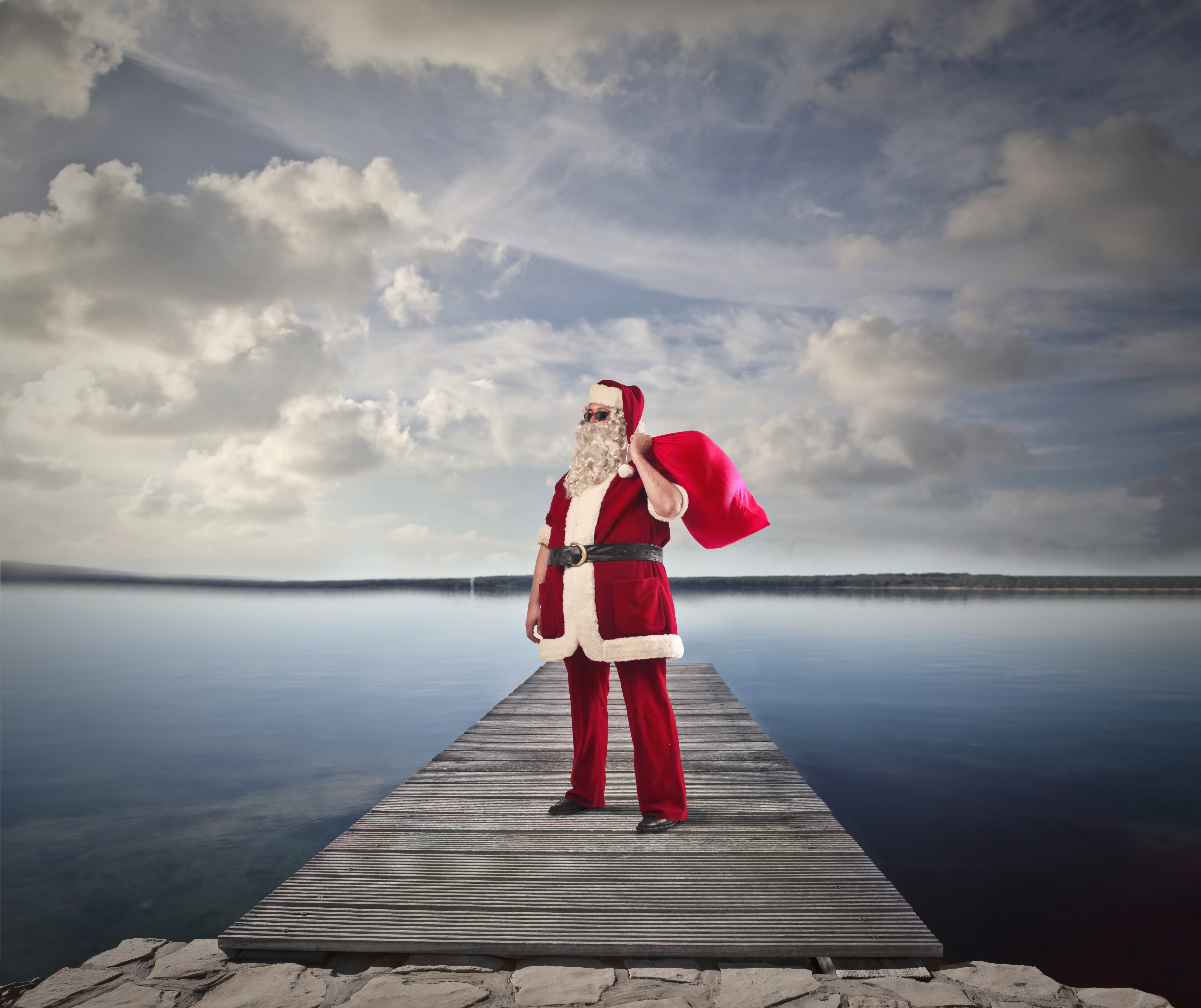 glasses, pants, pier, strap, clouds, Santa Claus, gifts, New year, holiday, beard, the sky, river, in red, coat, 5K, shore, bag, hat, Christmas, HD Wallpaper