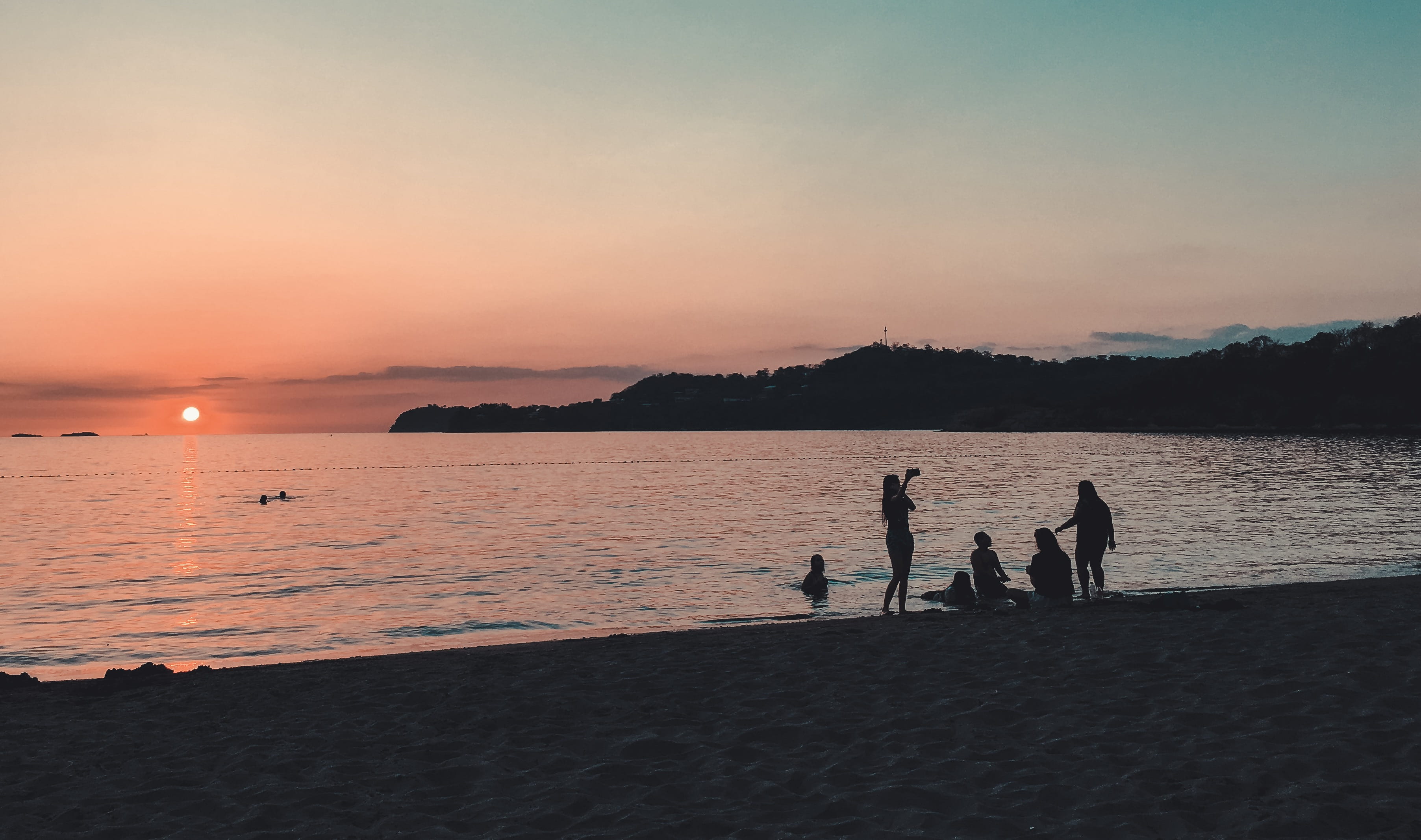 evening, tranquility, sunset, togetherness, landscape, land, horizon over water, spot, seascape, men, water, standing, people, 2K, sitting, sky, waves, HD Wallpaper