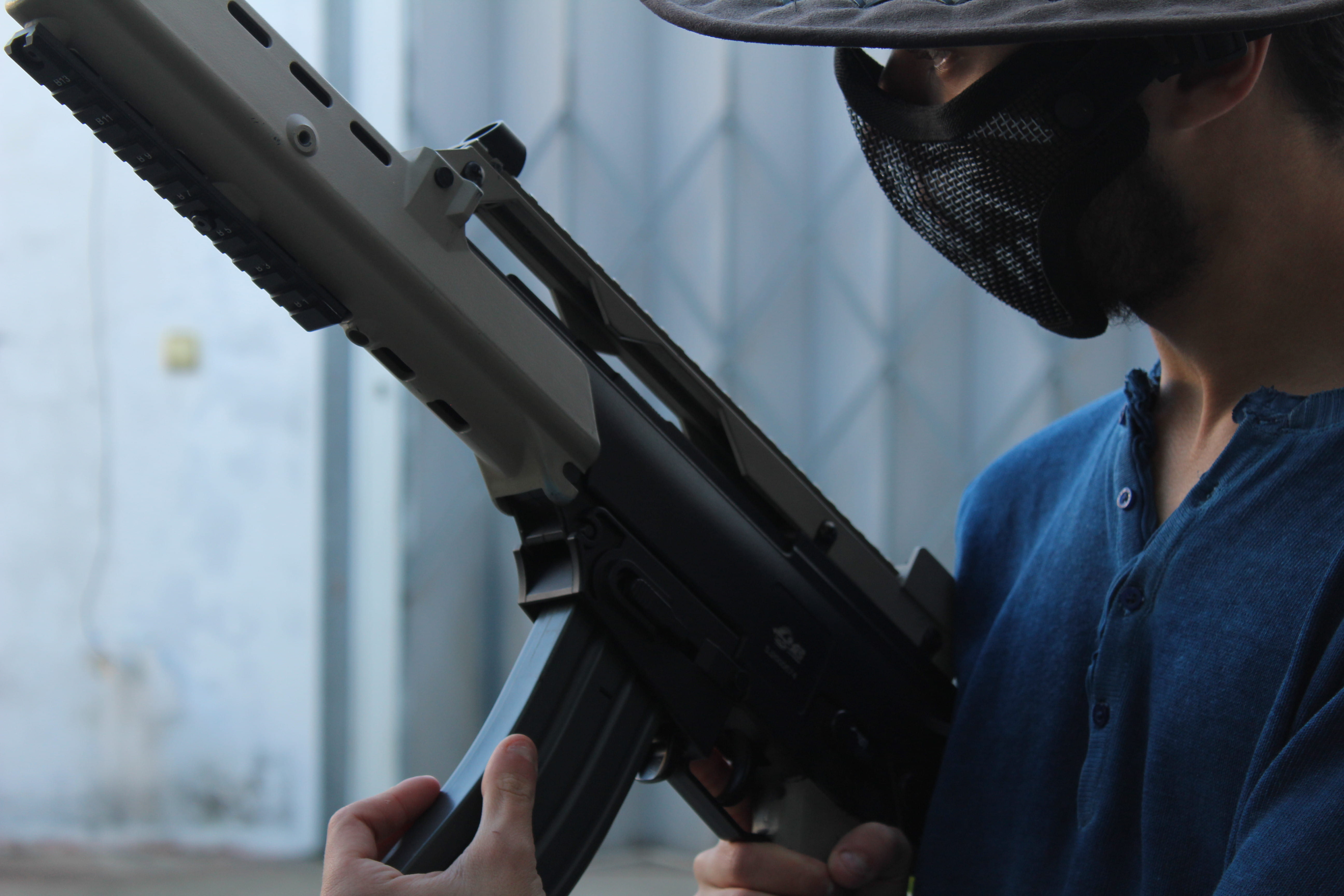 weapon, focus on foreground, portrait, 5K, concentration, adult, facemask, face, human body part, hat, mask, gun, real people, one person, holding, rifle, HD Wallpaper
