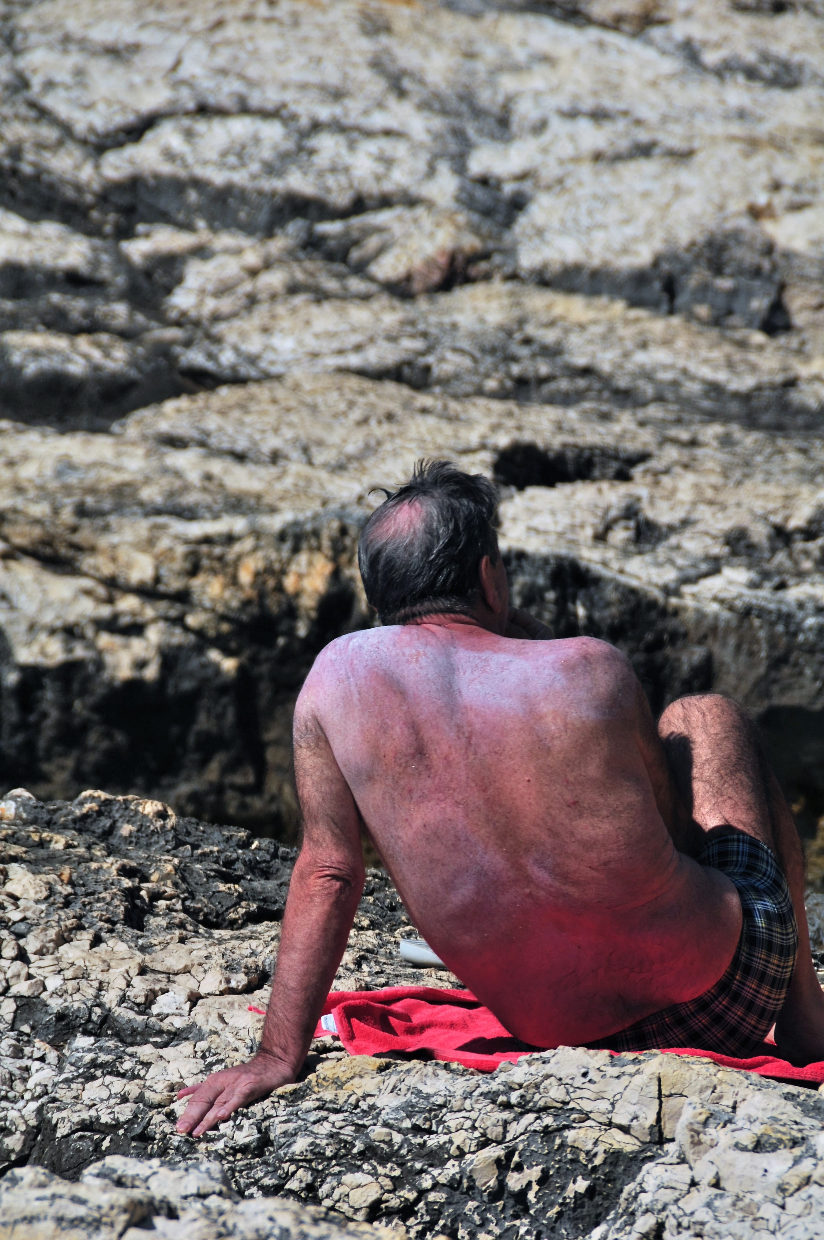 leisure activity, activity, sitting, travel, breaded, day, occupation, focus on foreground, outdoors, semi-dress, rest, rock - object, nature, shirtless, Phone HD Wallpaper