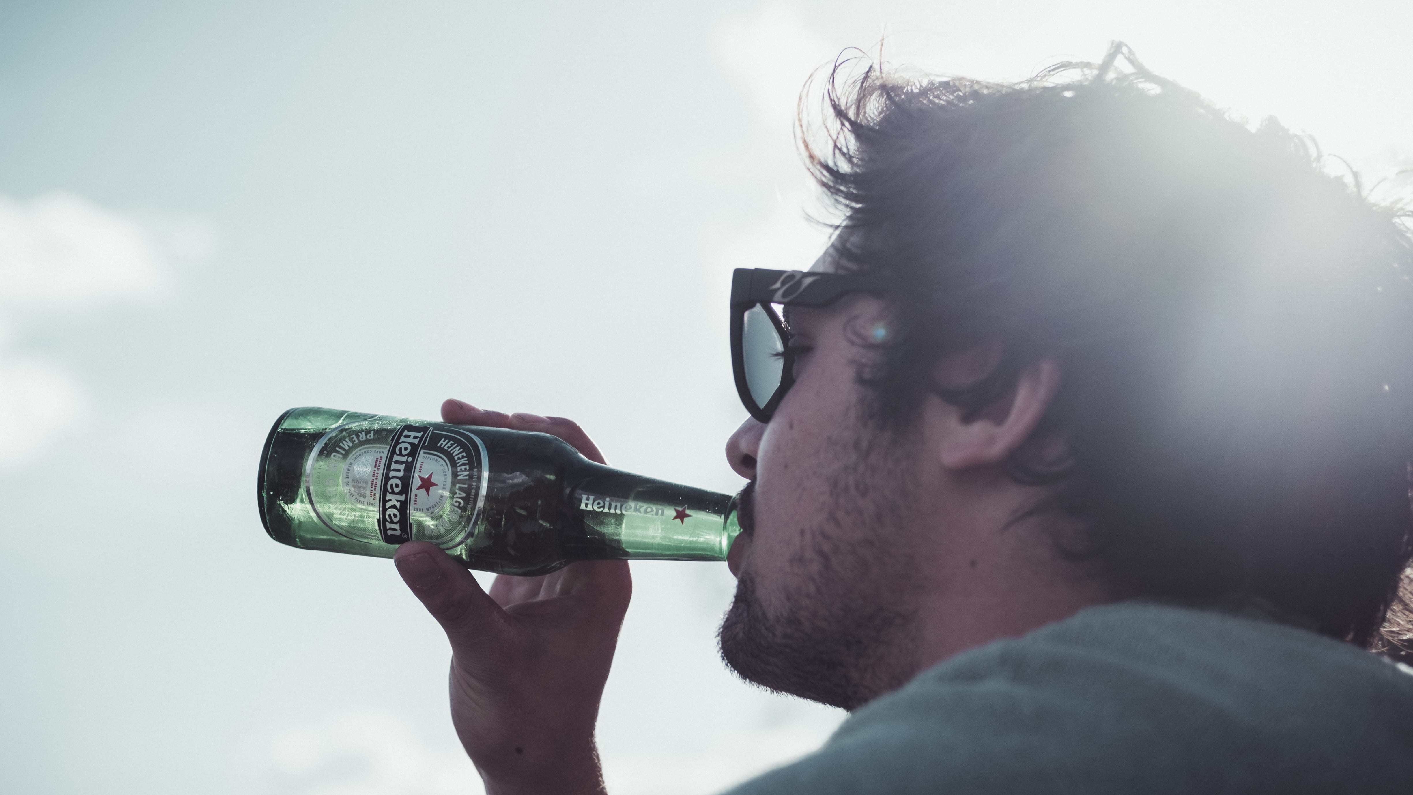 portrait, drinking, facial hair, side view, photography themes, enjoying life, heineken, technology, men, back lit, young adult, holding, young men, sky, HD Wallpaper