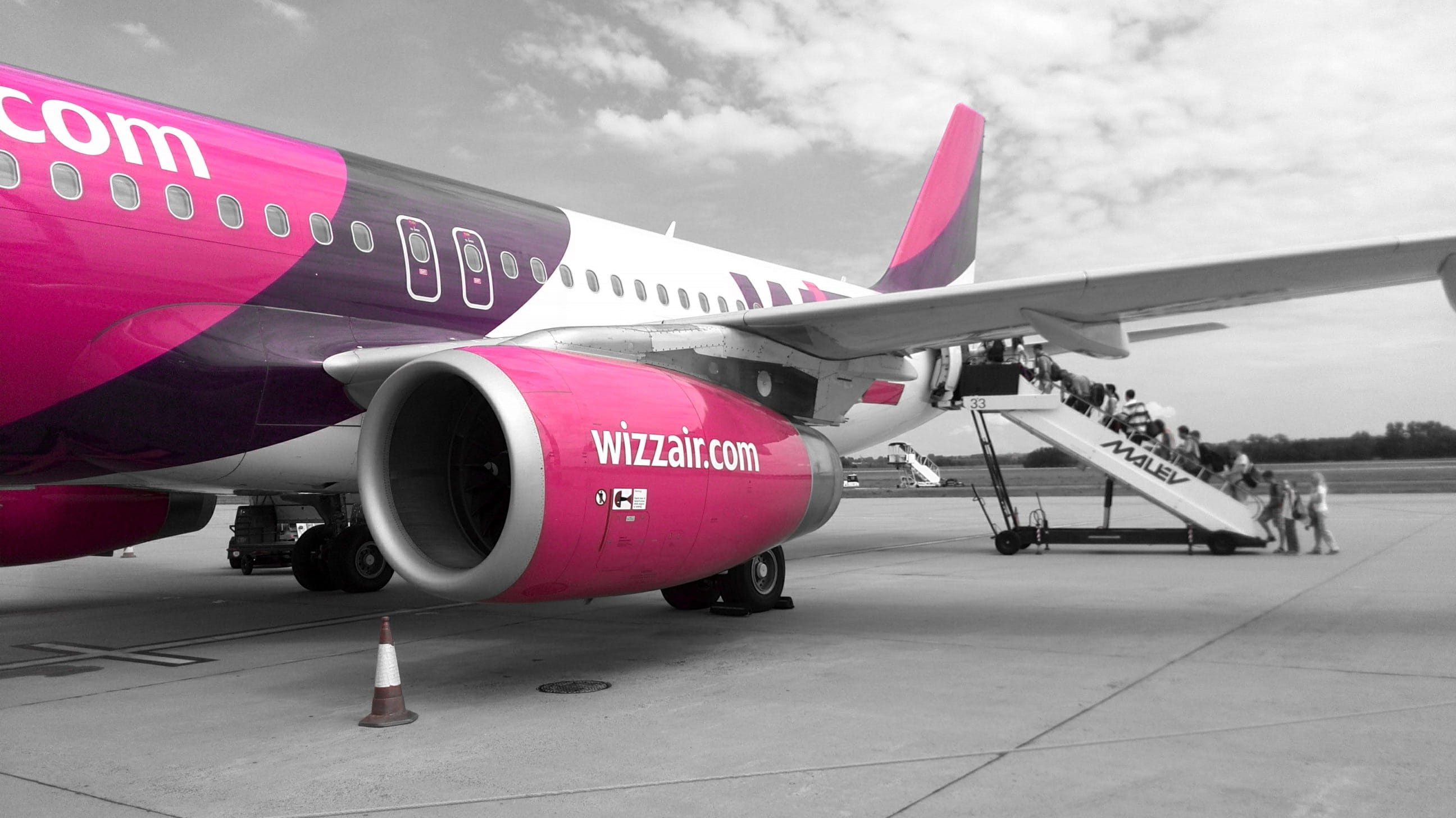 transportation, airport runway, flying, jet engine, no people, engine, aircraft wing, wizzair, fighter plane, army, pink, 2K, air vehicle, nature, mode of transportation, HD Wallpaper