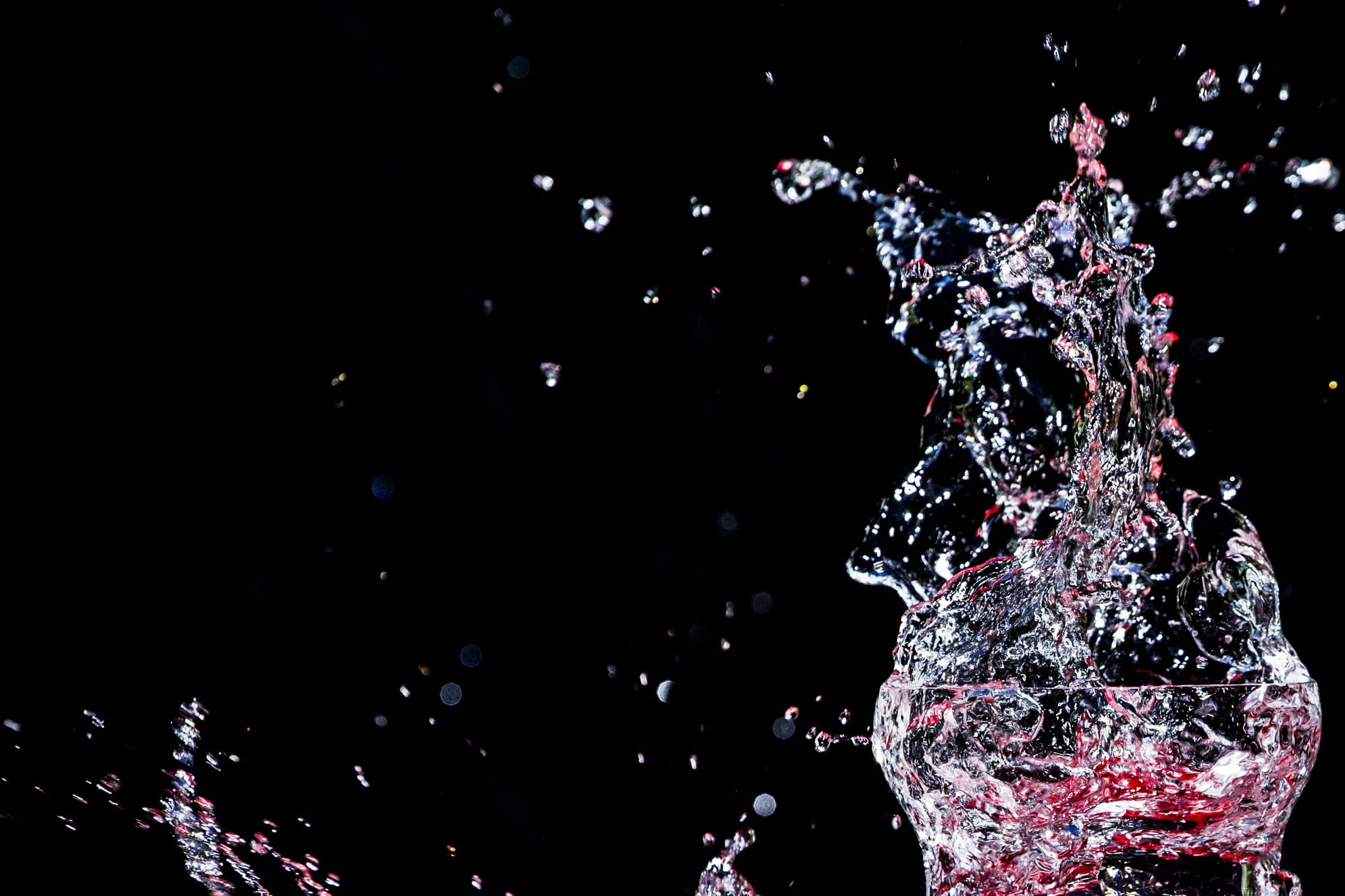 enjoyable, glass, fresh, no people, nature, purity, black background, exploding, bubbly, close-up, splash, motion, refreshment, celebration, abstract, illuminated, HD Wallpaper