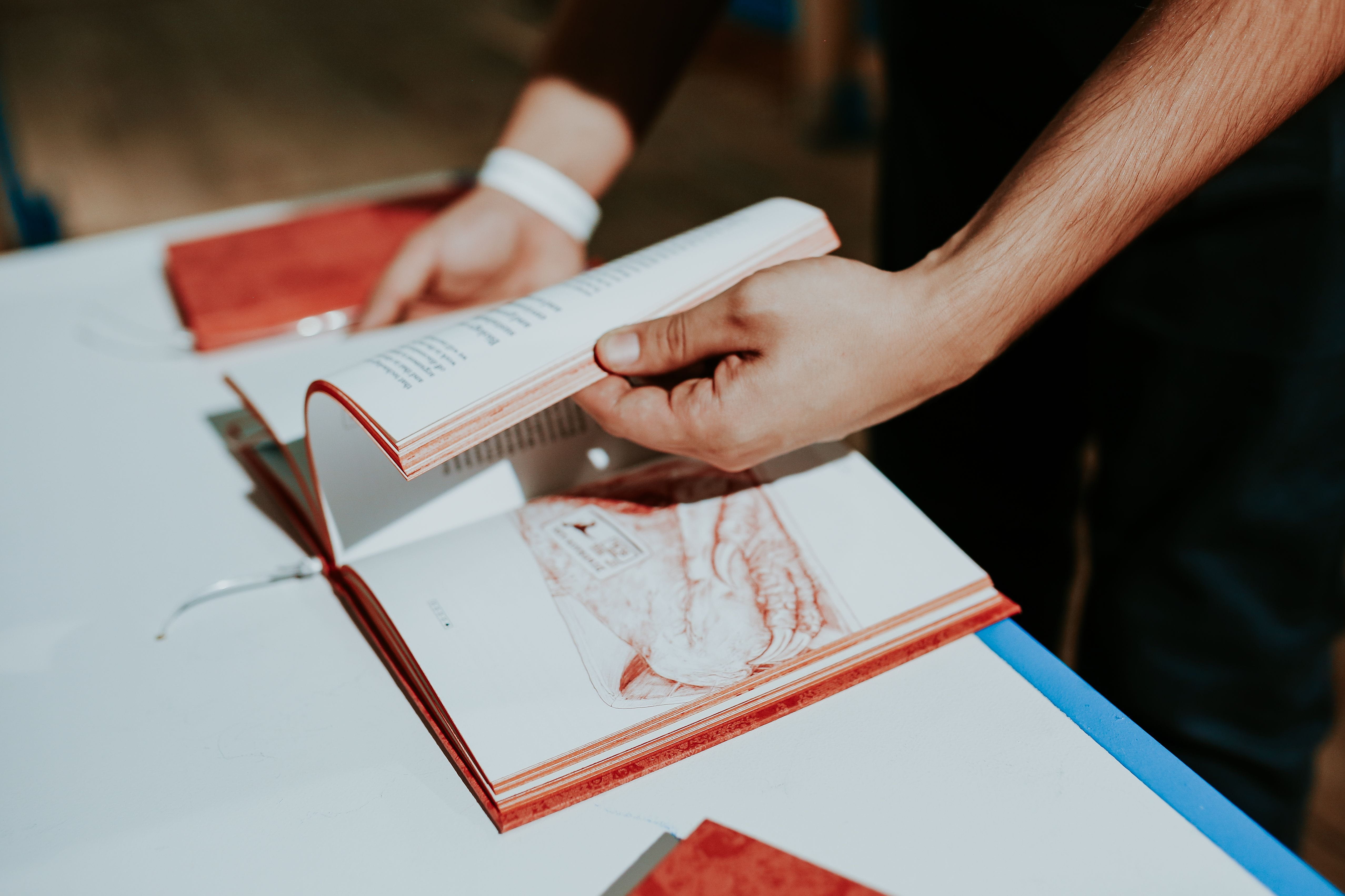 men, people, real people, midsection, close-up, hand, cookbook, paper, human body part, creativity, high angle view, Red book, indoors, two people, holding, HD Wallpaper