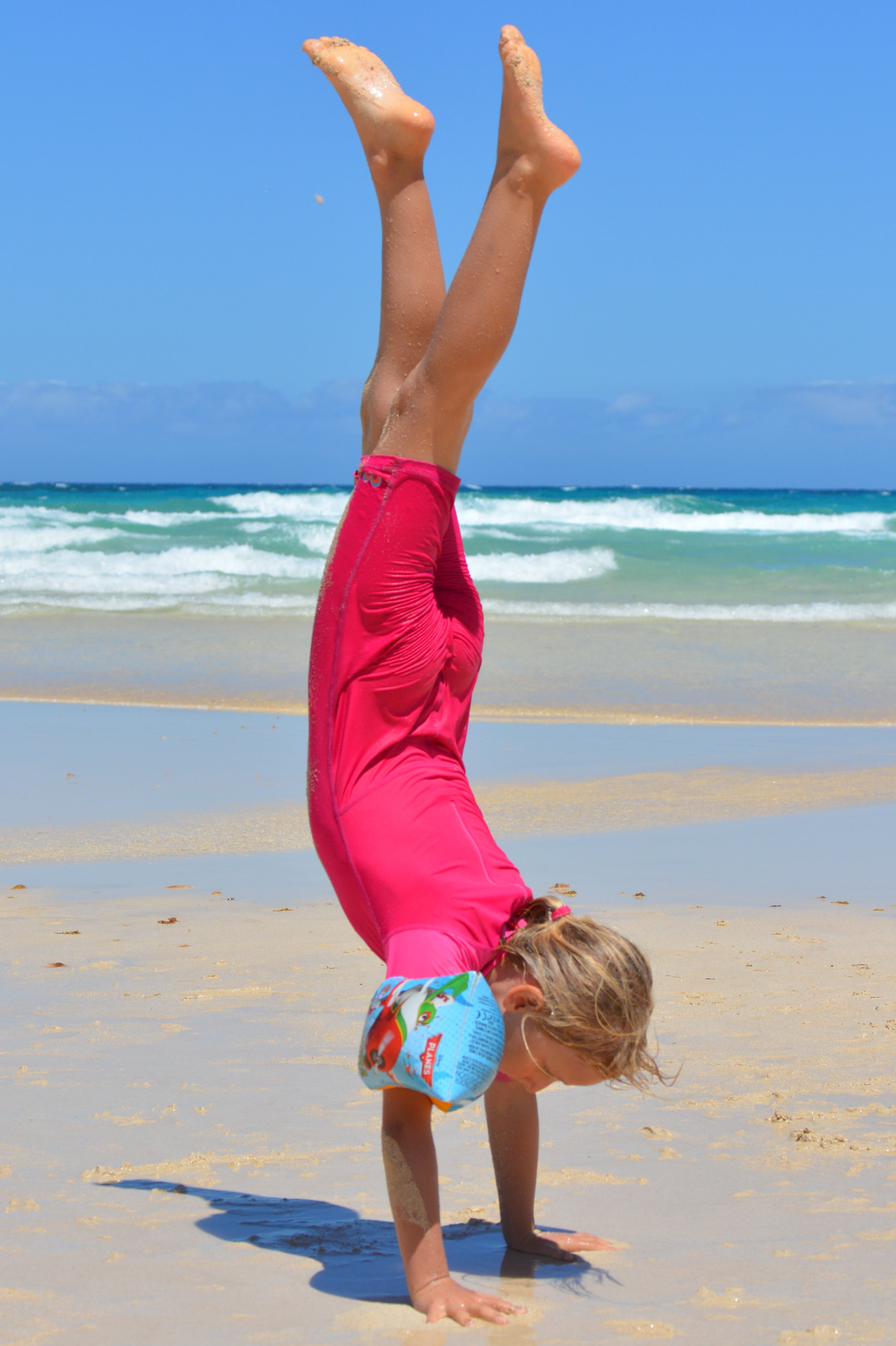 one person, people, water, sand, child, leisure activity, full length, ocean, girl, sky, beauty in nature, uv-resistant clothing, agility, real people, Phone HD Wallpaper