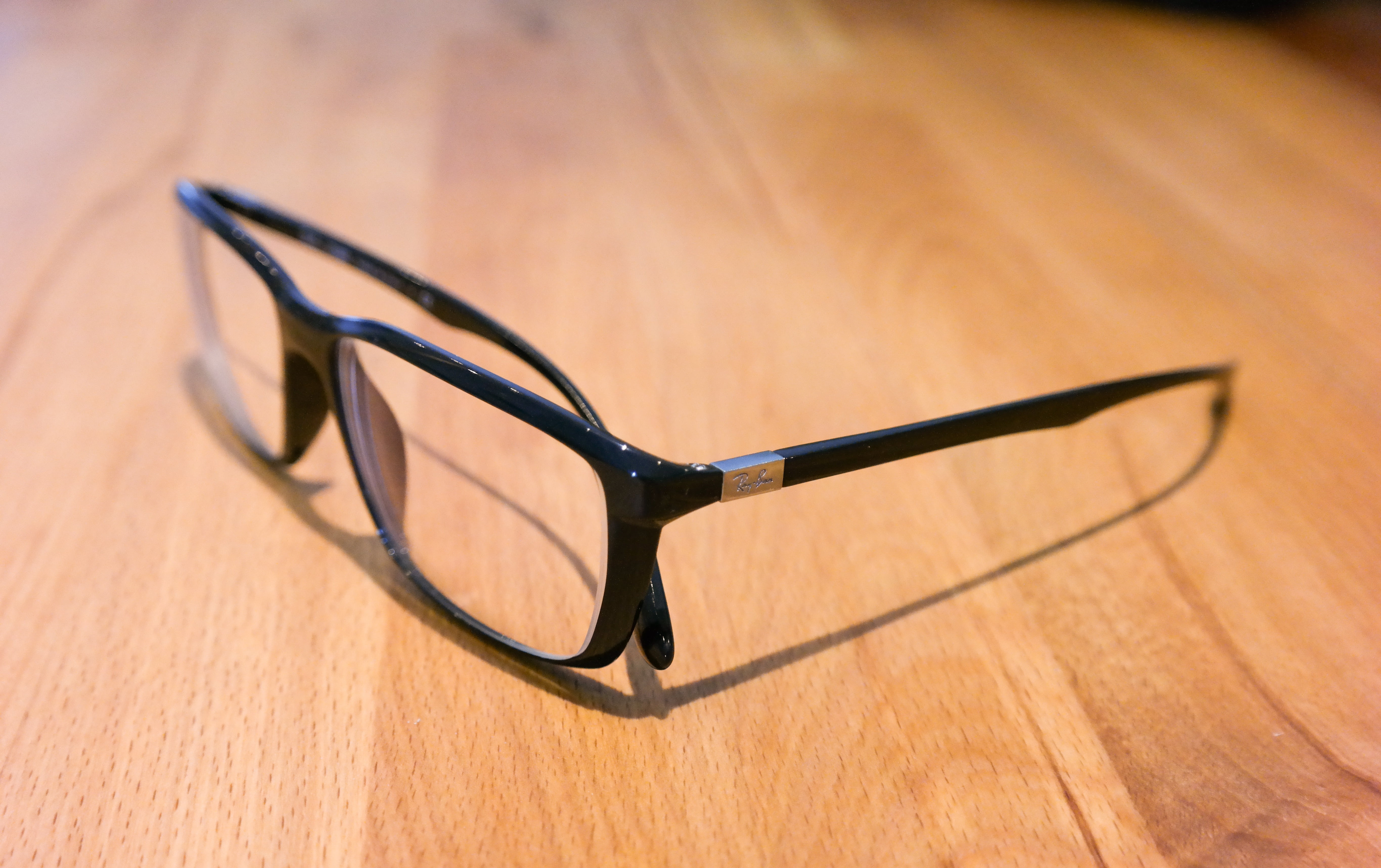 5K, close-up, no people, hardwood floor, ray ban, black color, wood grain, high angle view, single Object, black, framed, business, indoors, ornate, wood - Material, HD Wallpaper