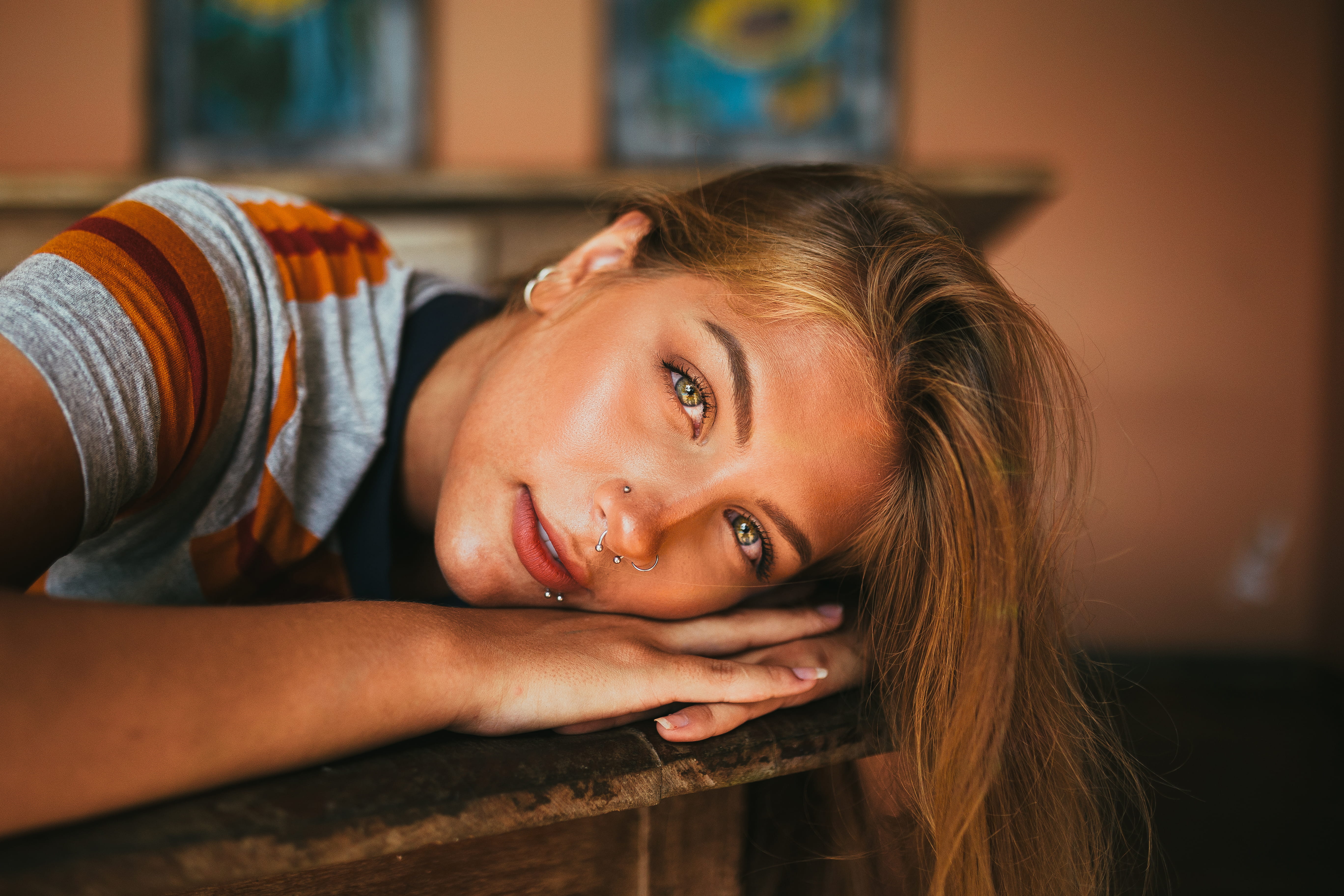 person, bright eyes, contemplation, beauty, depth of field, lying down, piercings, hairstyle, selective focus, photo, close, focus on foreground, indoors, HD Wallpaper