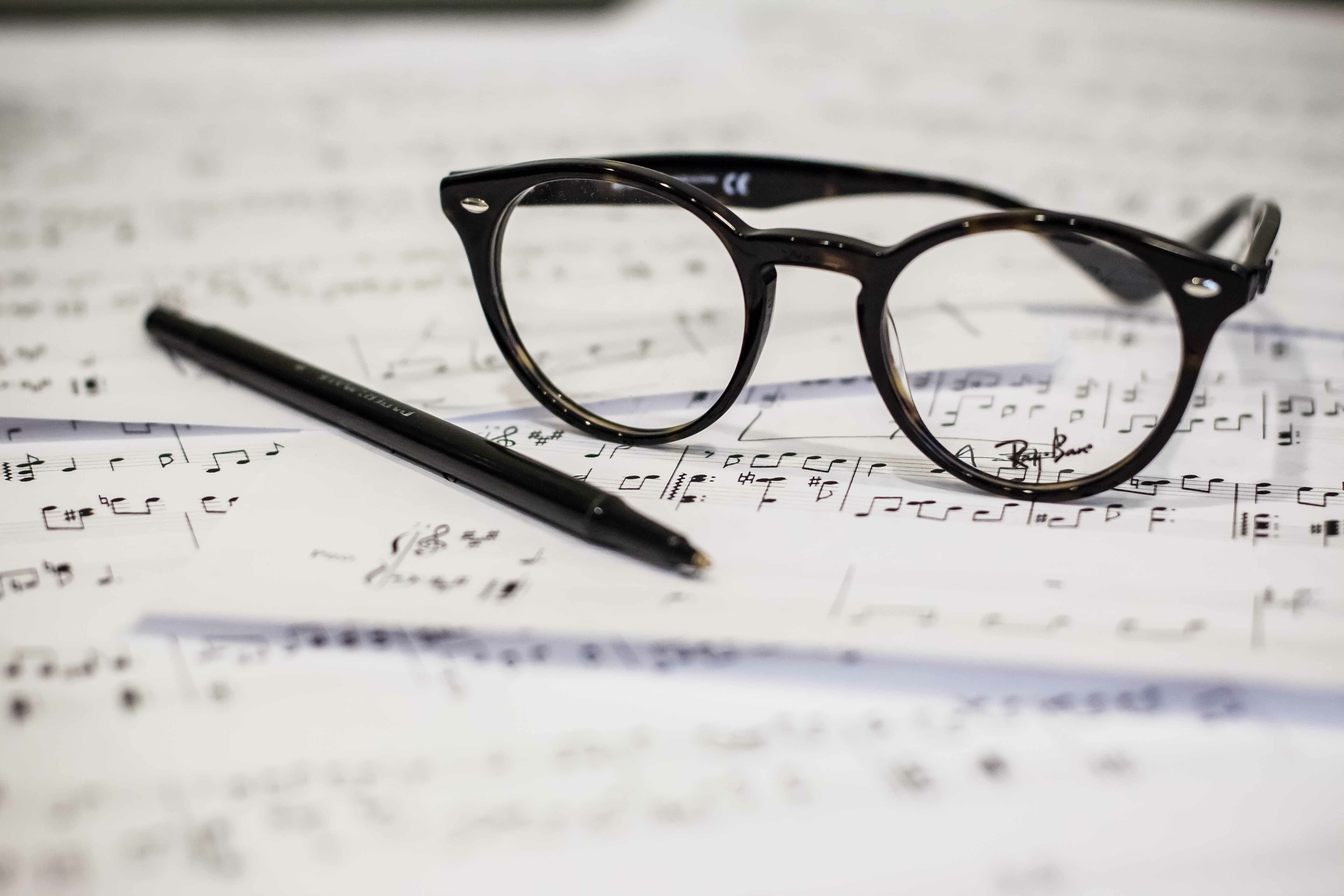 focus on foreground, eye test equipment, music, eyewear, reading glasses, still life, no people, education, indoors, close-up, studio shot, beside, black, HD Wallpaper