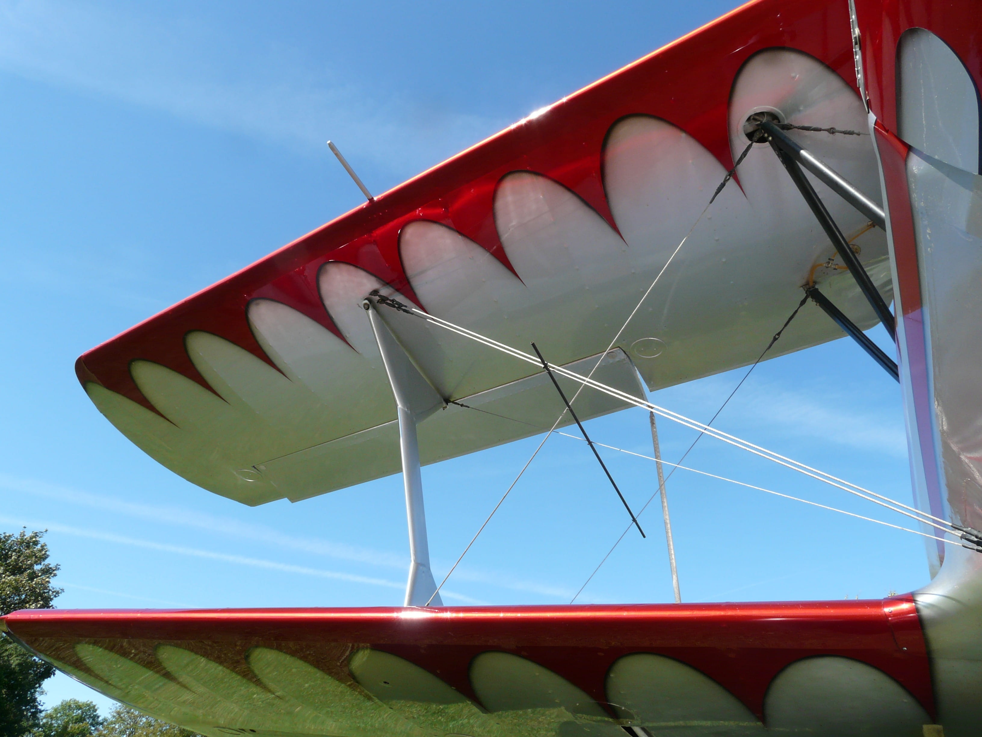 outdoors, silver, amusement park, aircraft, shiny, clear sky, 2K, sunny, built structure, sunlight, wings, transportation, red, sky, close-up, multi colored, HD Wallpaper