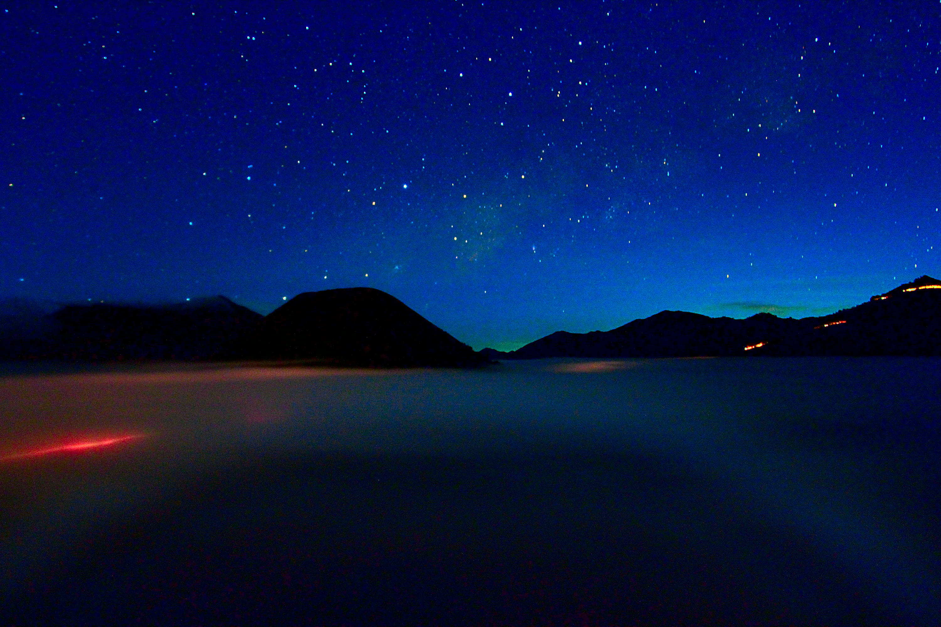 illuminated, 2K, mountain, cosmic, astronomy, earth, star, beauty in nature, sky, world, cosmos, evening, idyllic, star - space, star field, cloud, galaxy, HD Wallpaper