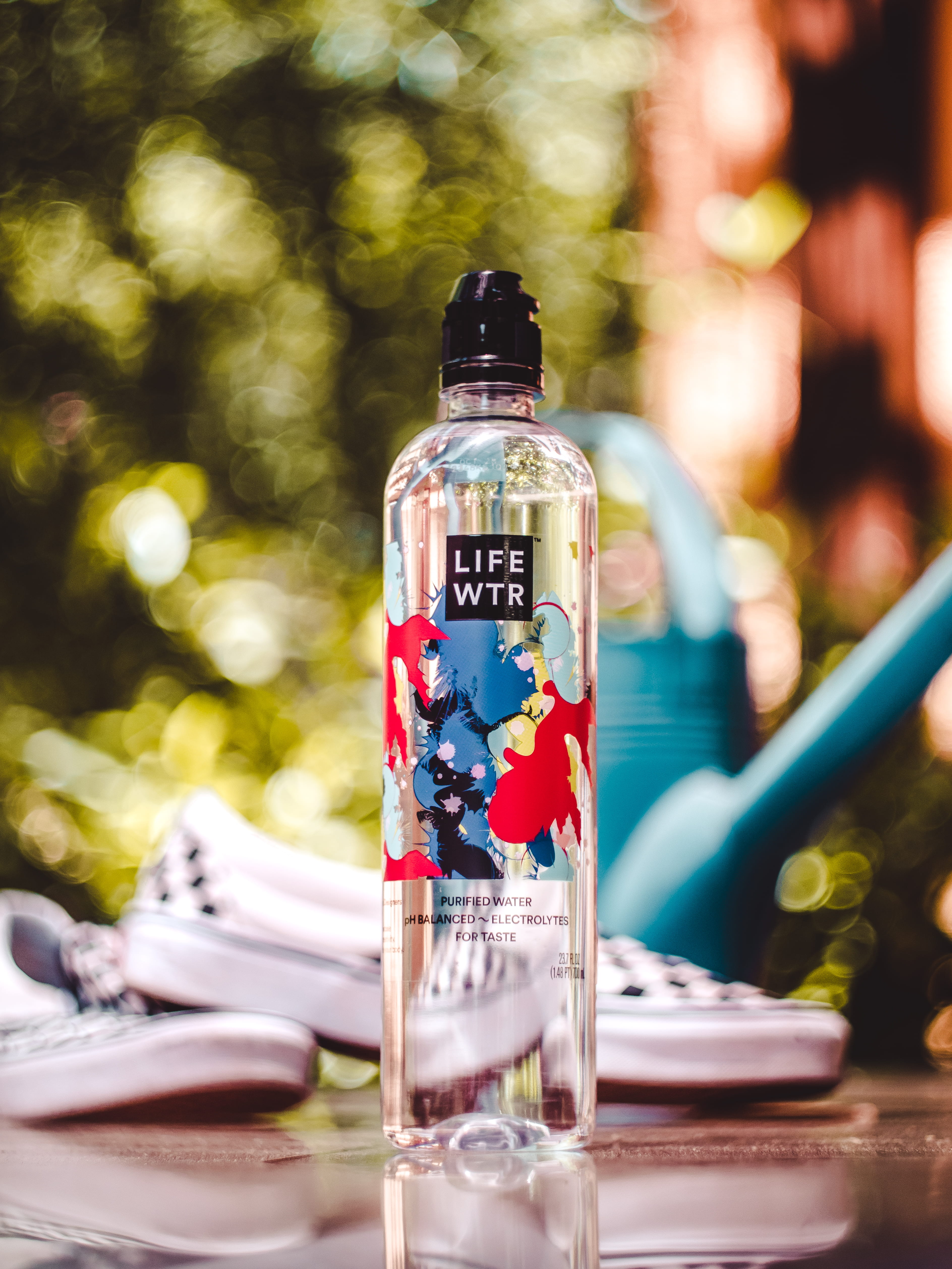near, bottle, water, food and drink, drinking water, container, selective focus, still life, outdoors, wtr, day, black, no people, slip, table, drink, life, Phone HD Wallpaper
