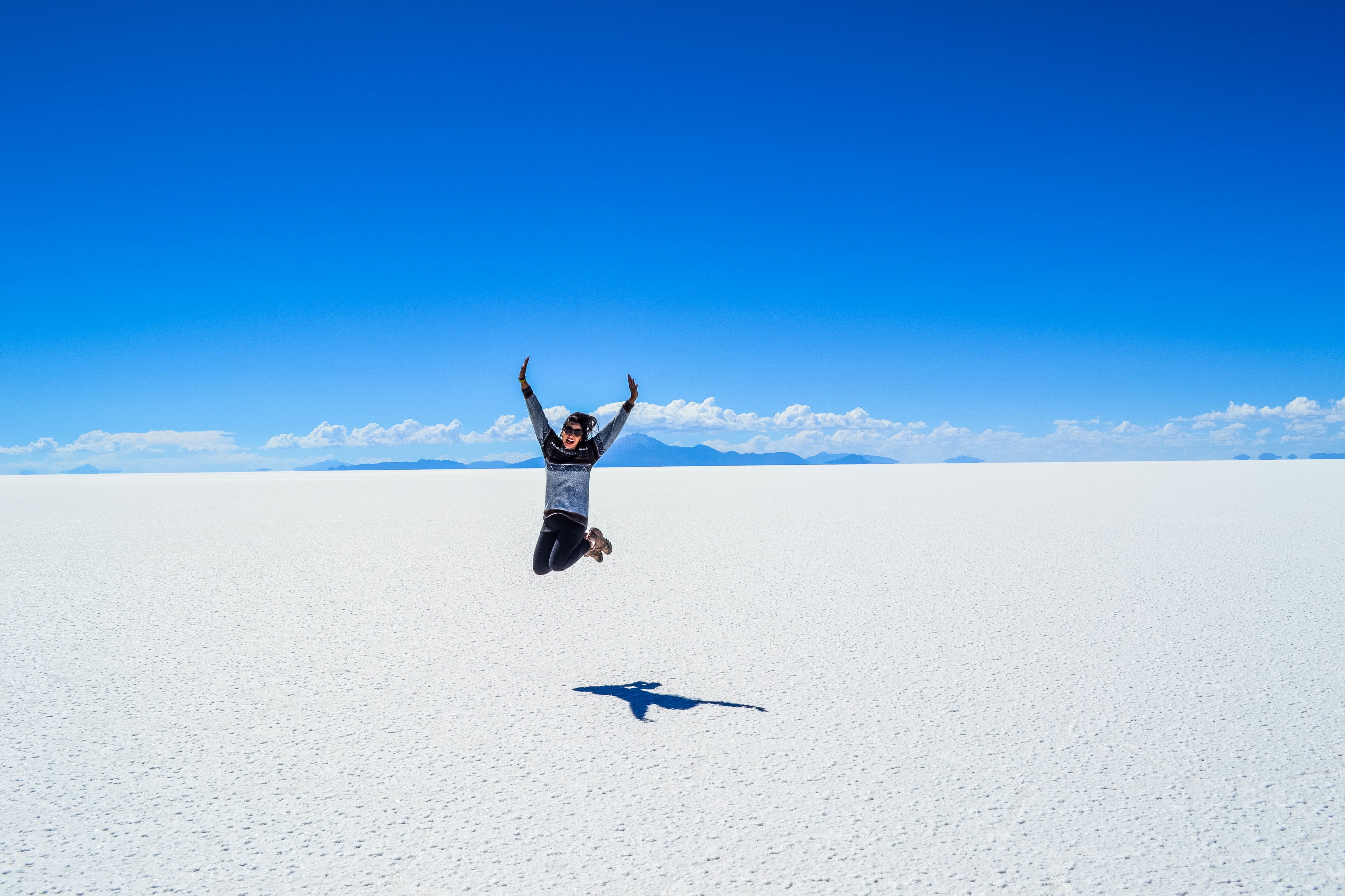 day, one Person, sunlight, vacations, land, full length, daytime, mid-air, crew, jumping, copy Space, desert, black and gray, limb, landscape, non-urban scene, HD Wallpaper
