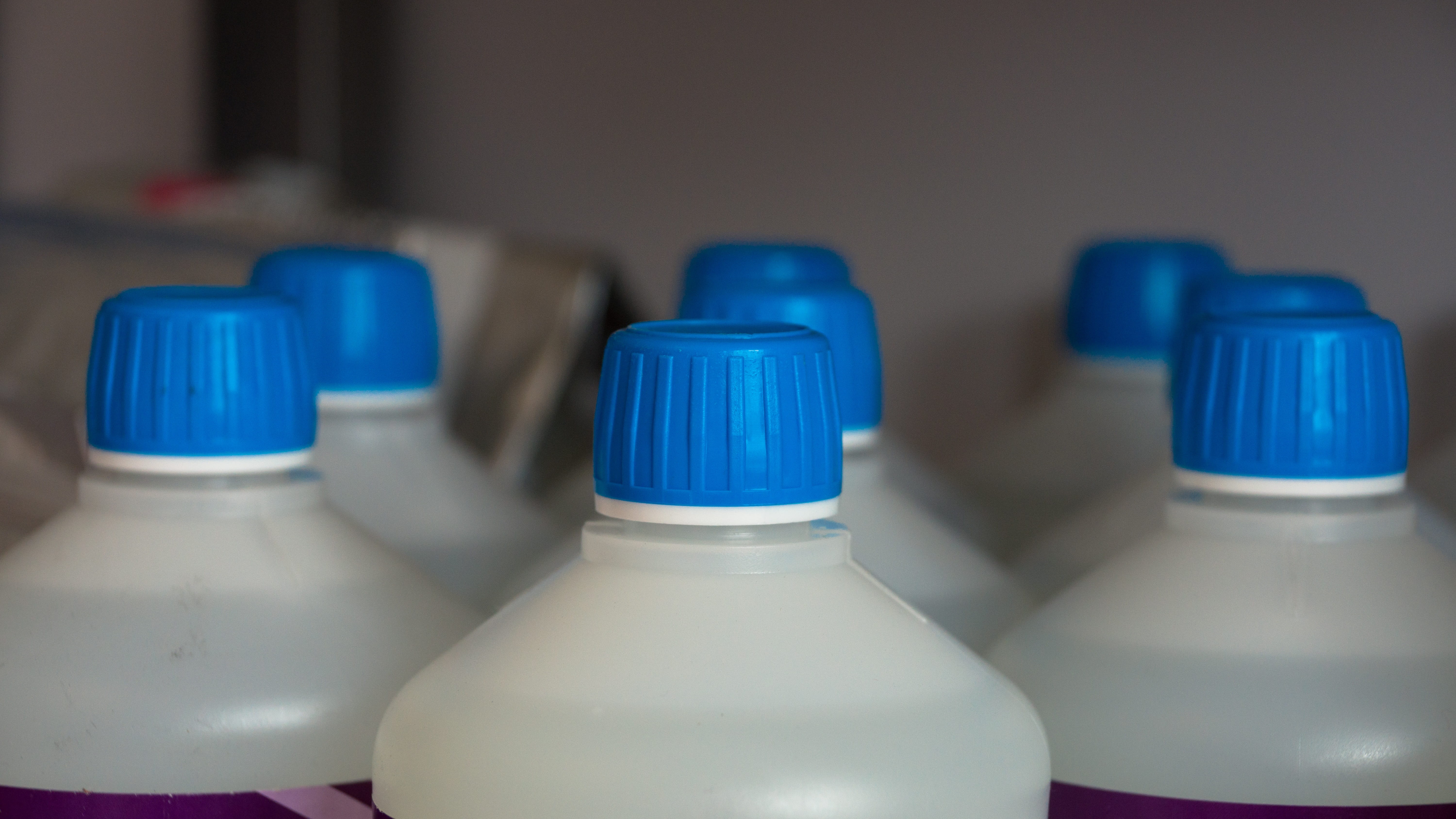 Bottles, Cap, focus on foreground, bottle, drink, group of objects, blue, detergent, retail, wall, laboratory, plastic, Container, refreshment, 5K, water bottle, HD Wallpaper