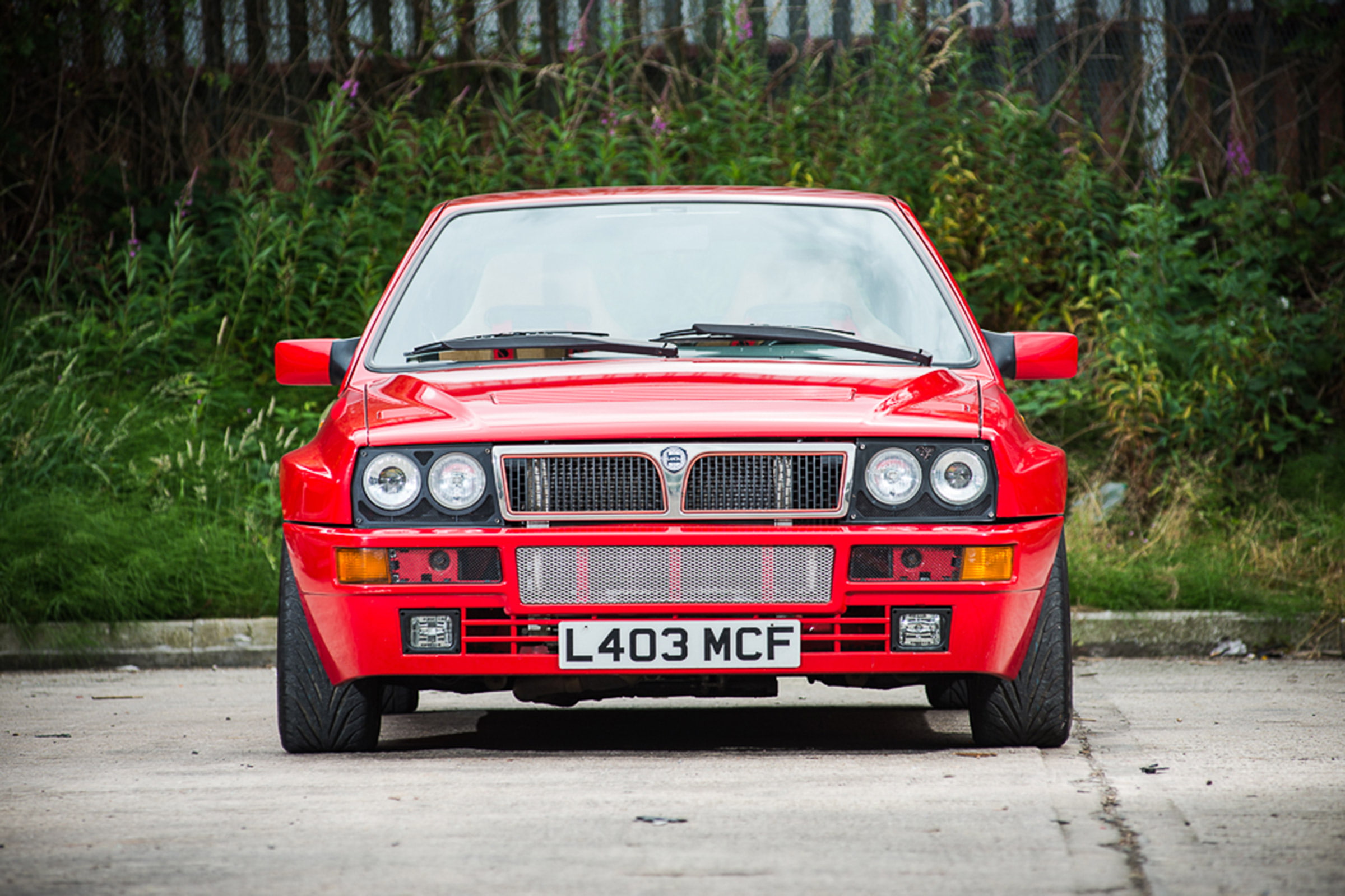 delta, text, motor vehicle, transportation, western script, retro styled, lancia, tree, evoluzione, land vehicle, 1080P, travel, road, car, motion, red, HD Wallpaper