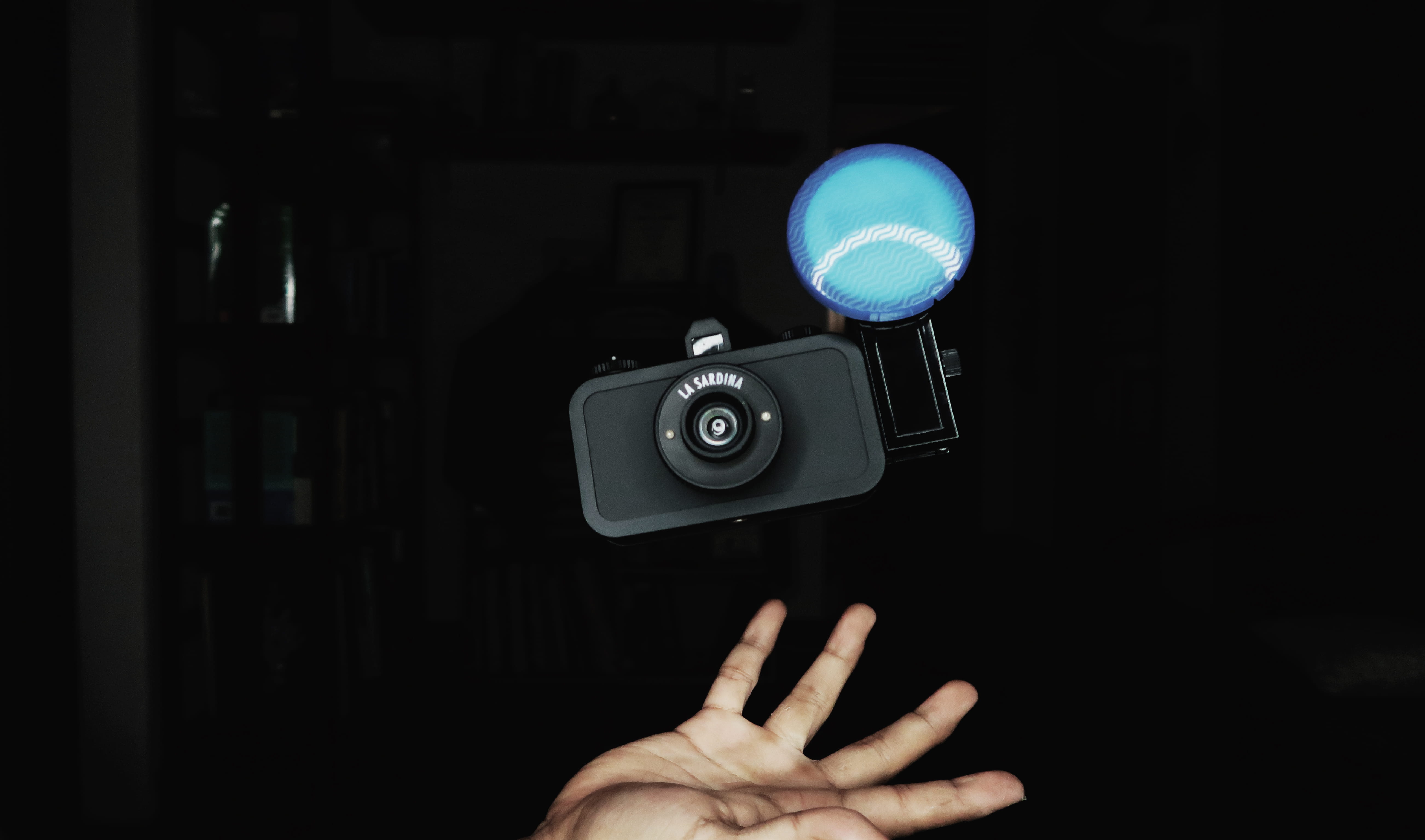 film industry, camera - photographic equipment, human hand, one person, black color, lomography, dark, focus on foreground, arts culture and entertainment, HD Wallpaper