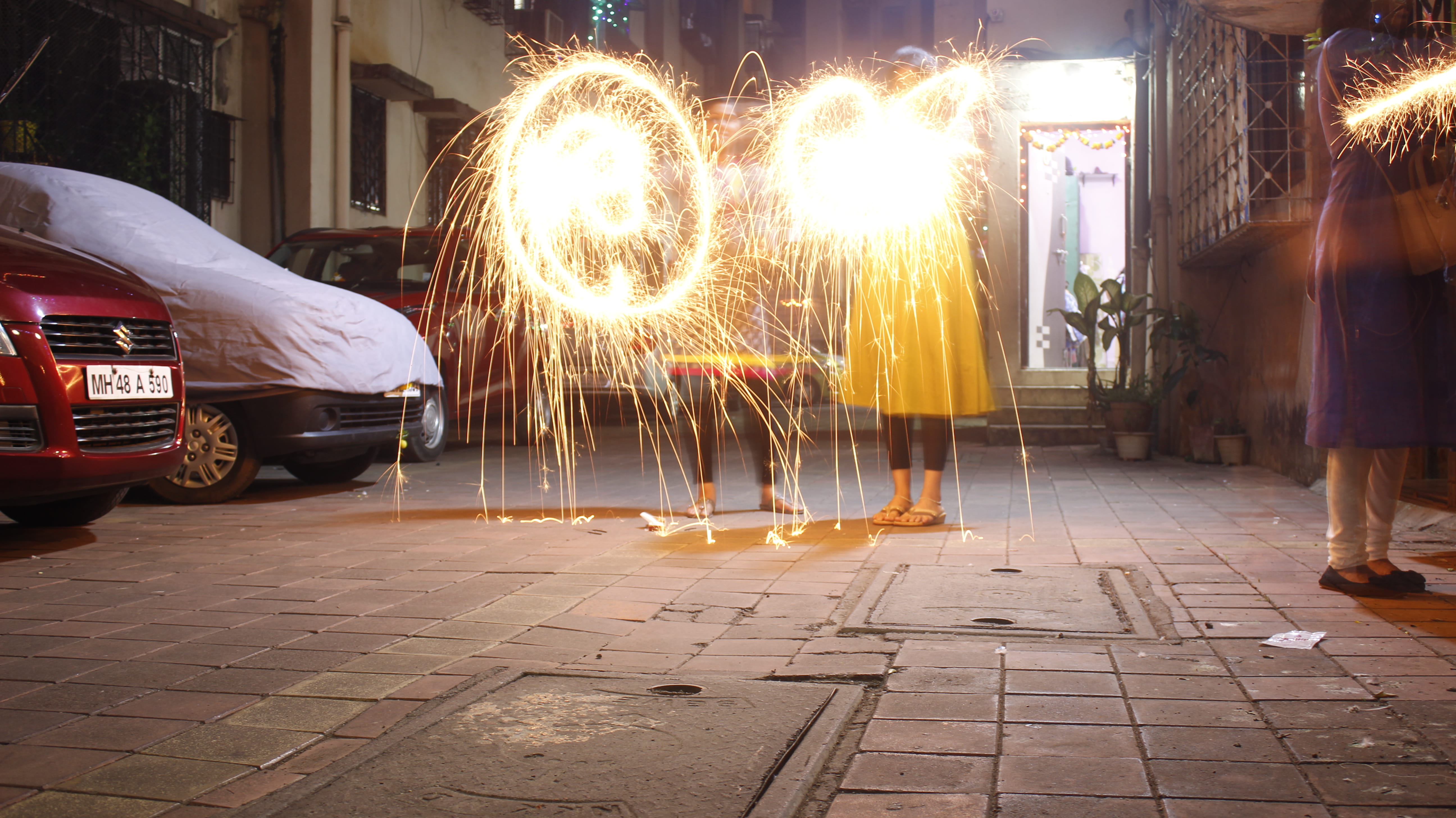 men, motor vehicle, night, paving stone, sparkle, blurred motion, one person, city, illuminated, outdoors, firework, women, firework - man made object, HD Wallpaper