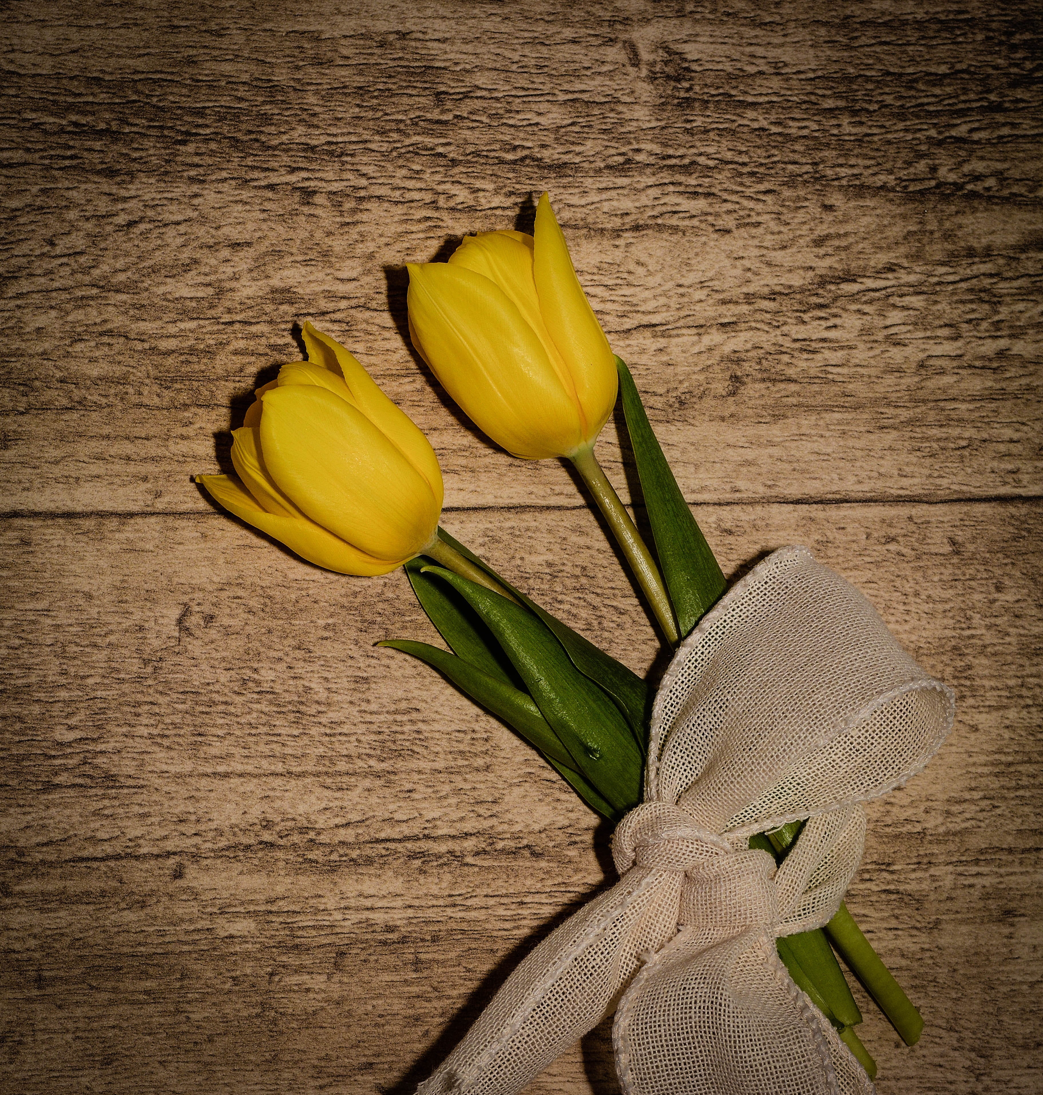 yellow flowers, decoration, indoors, table, no People, wood, love, tulip, green Color, wood - Material, celebration, vulnerability, close-up, flowering plant, Phone HD Wallpaper