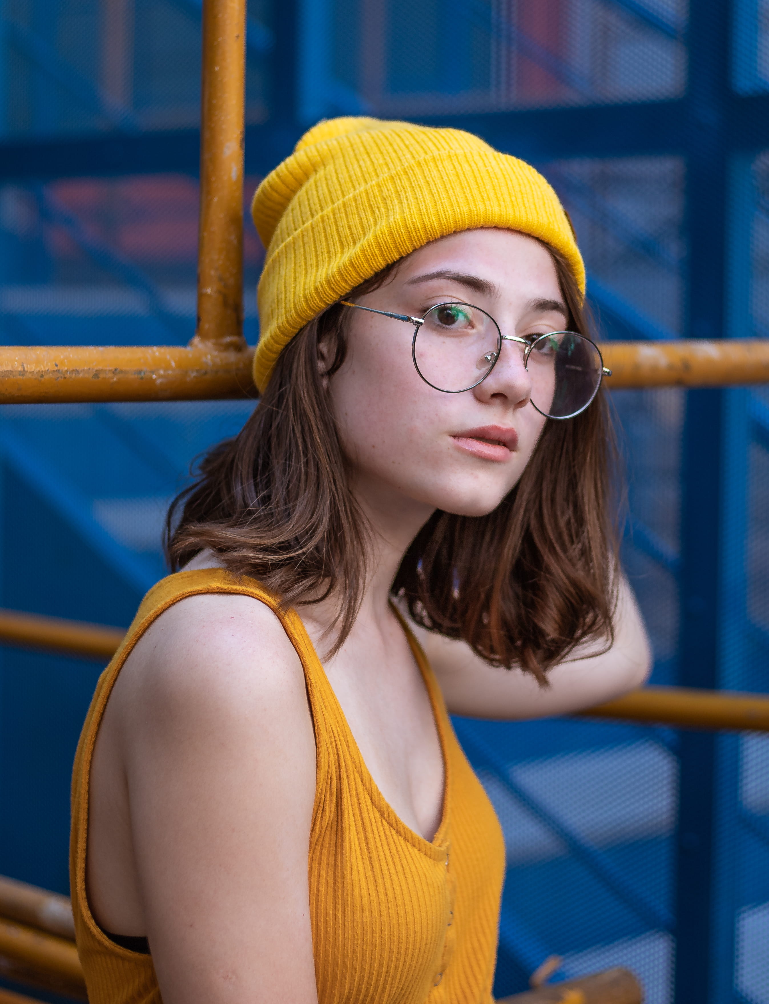 clothing, glasses, woman, cap, young, 2K, eyeglasses, hippie, beautiful woman, fashion, waist up, hair, tank, women, person, beautiful, young adult, yellow, Phone HD Wallpaper