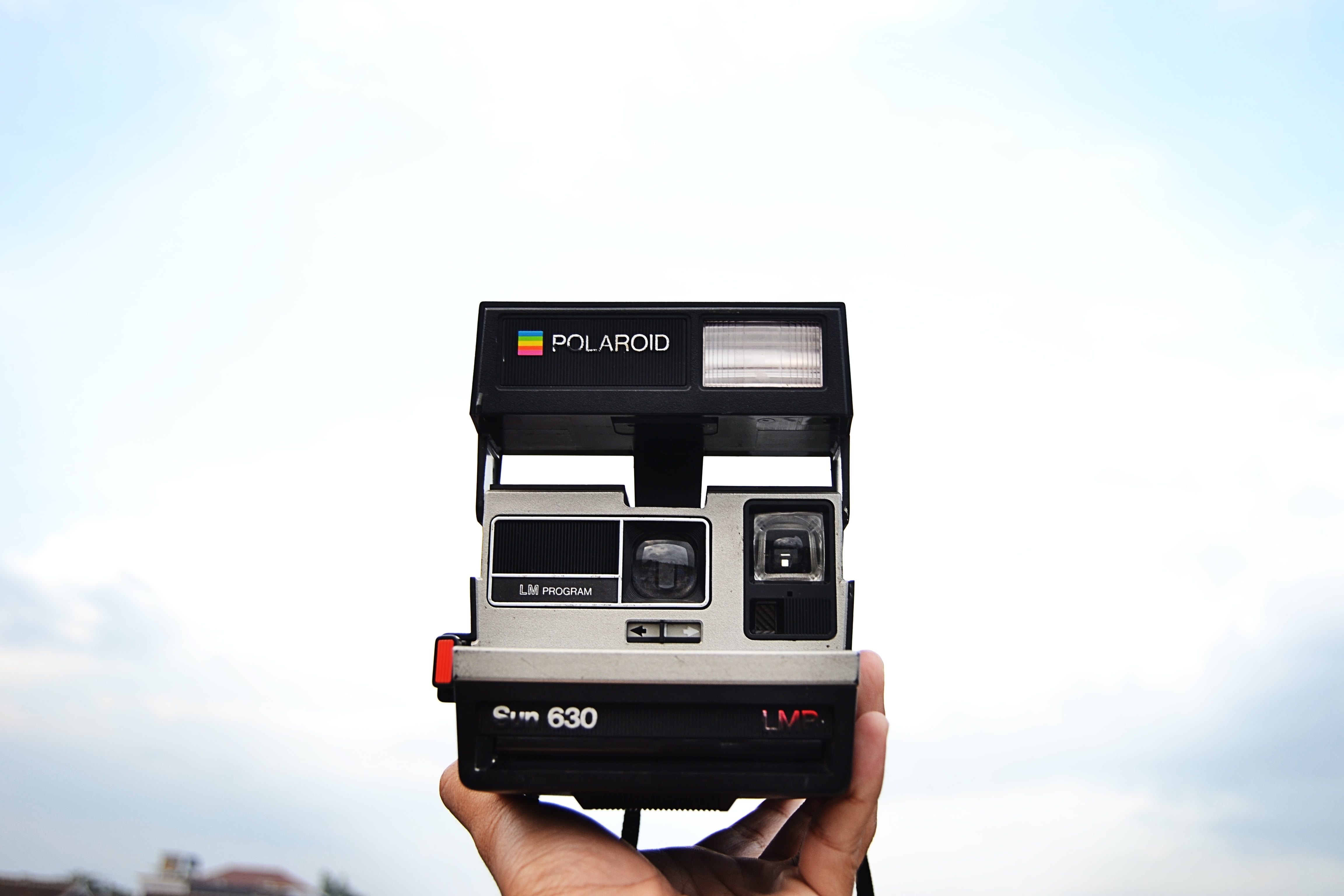 technology, black, real people, old-fashioned, old, digital camera, instant, camera - Photographic Equipment, cloud - sky, one person, day, photography Themes, HD Wallpaper