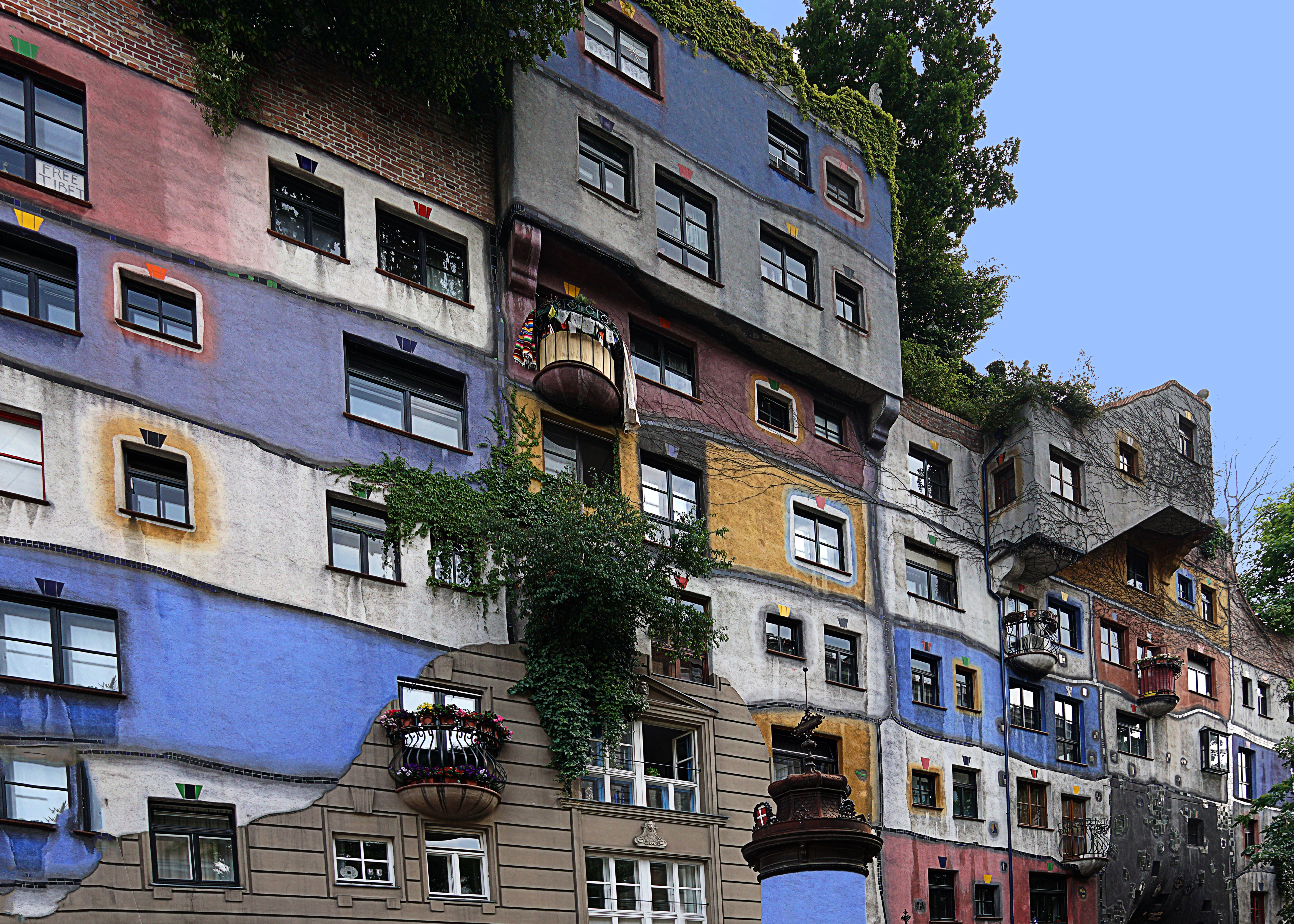 city, sunlight, clear sky, day, nature, low angle view, built structure, house, plant, residential district, no people, outdoors, hundertwasser house, building exterior, HD Wallpaper