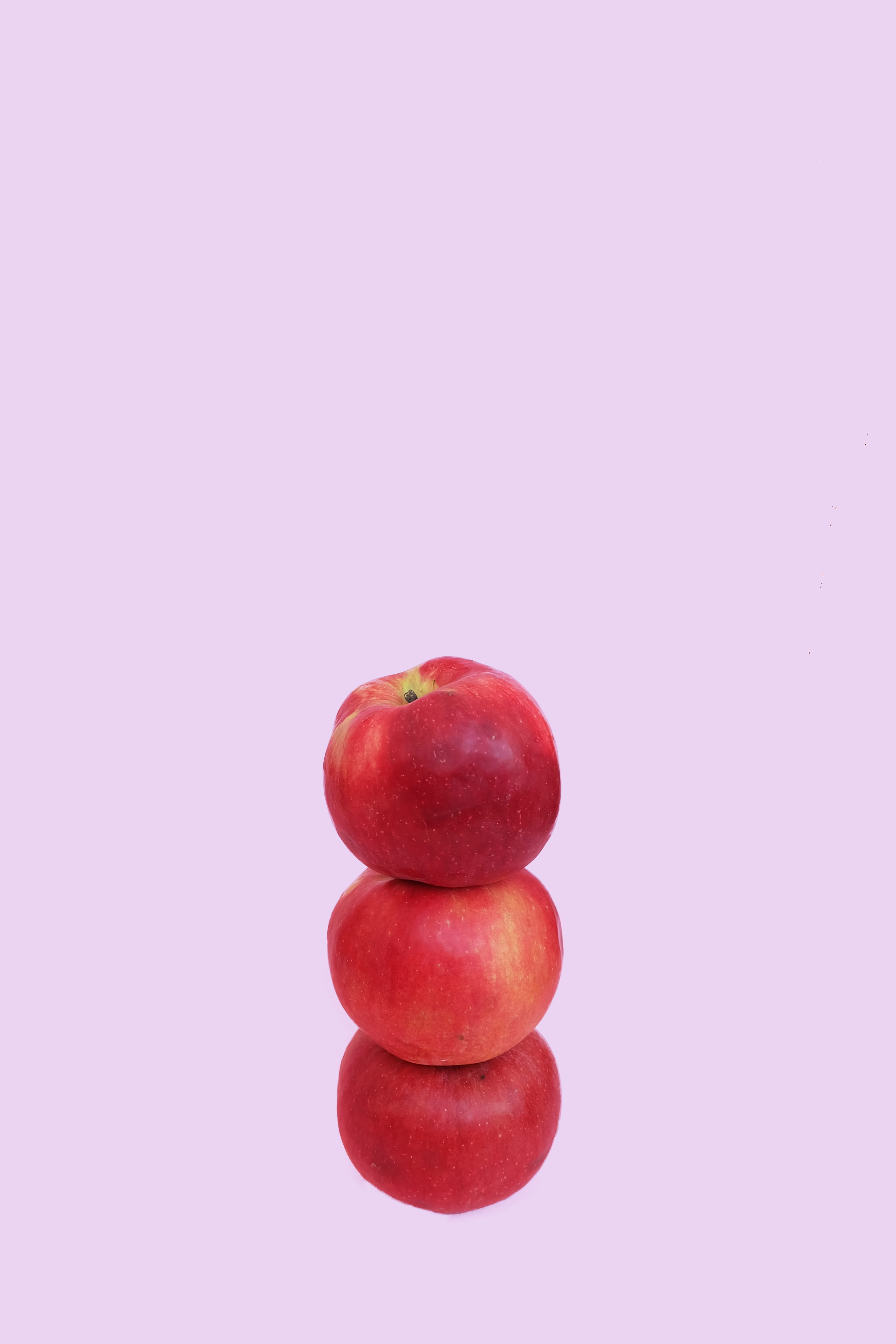 red, apple - fruit, ripe, studio shot, no people, overlapping, organic, still life, wellbeing, close-up, pink background, 4K, colored background, apples, Phone HD Wallpaper