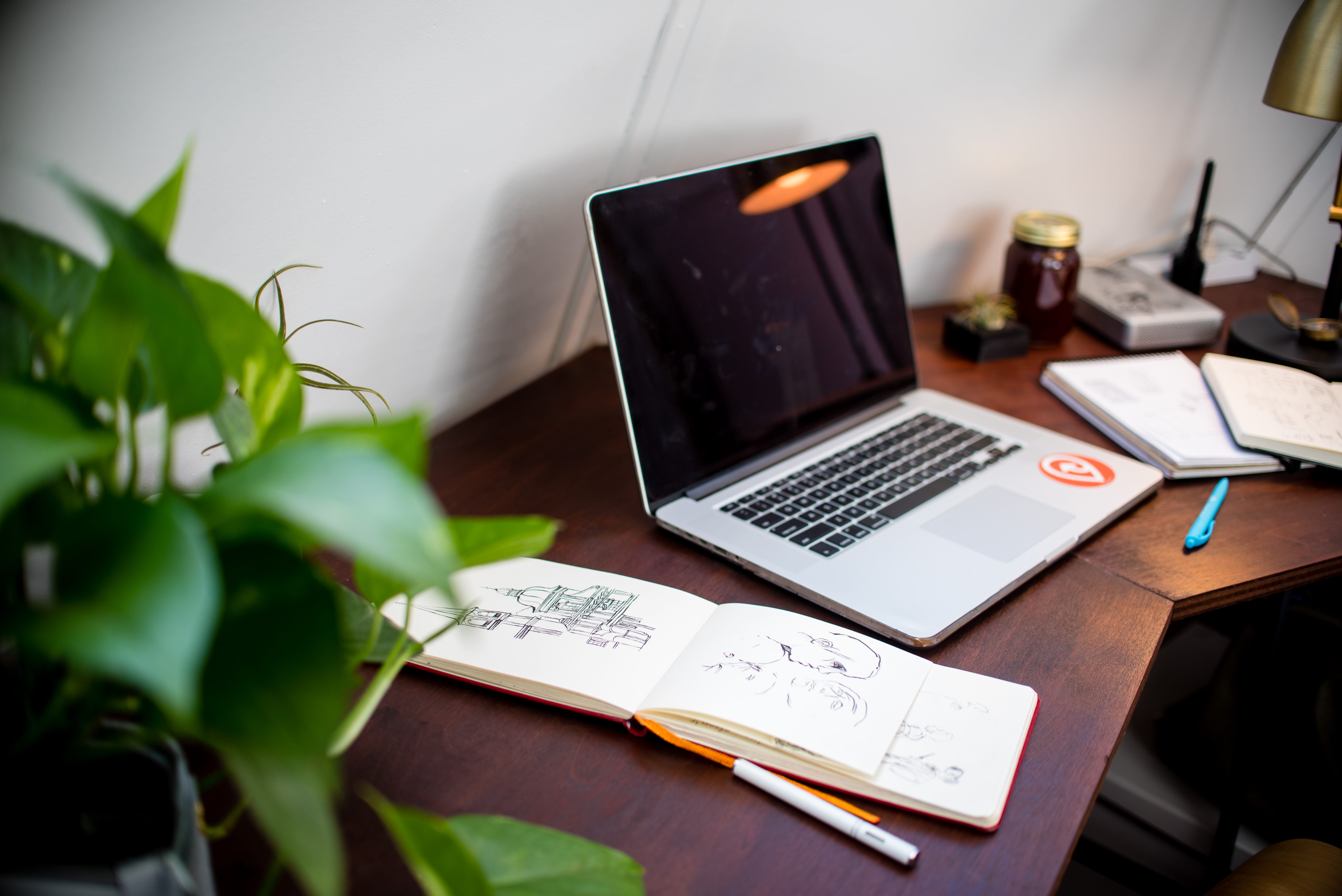 computer, table, sketch, pen, paper, wireless technology, no people, laptop, opened, beside, leaf, indoors, houseplant, plant, furniture, nature, business, HD Wallpaper