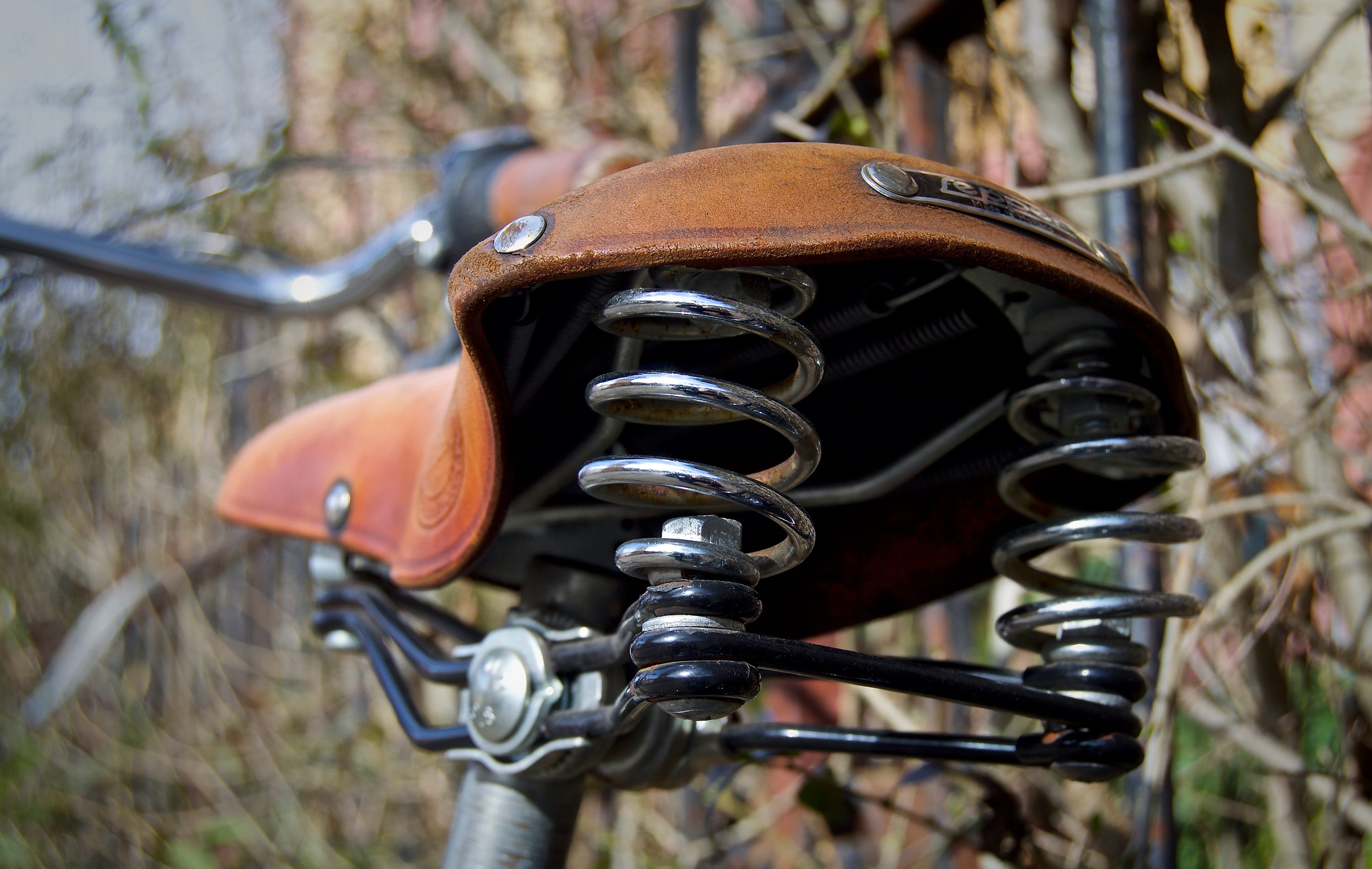 tanned, leather saddle, retracted, close-up, land vehicle, land, outdoors, bicycle saddle, seat, bicycle, no people, manufactory, hand labor, close, used, HD Wallpaper