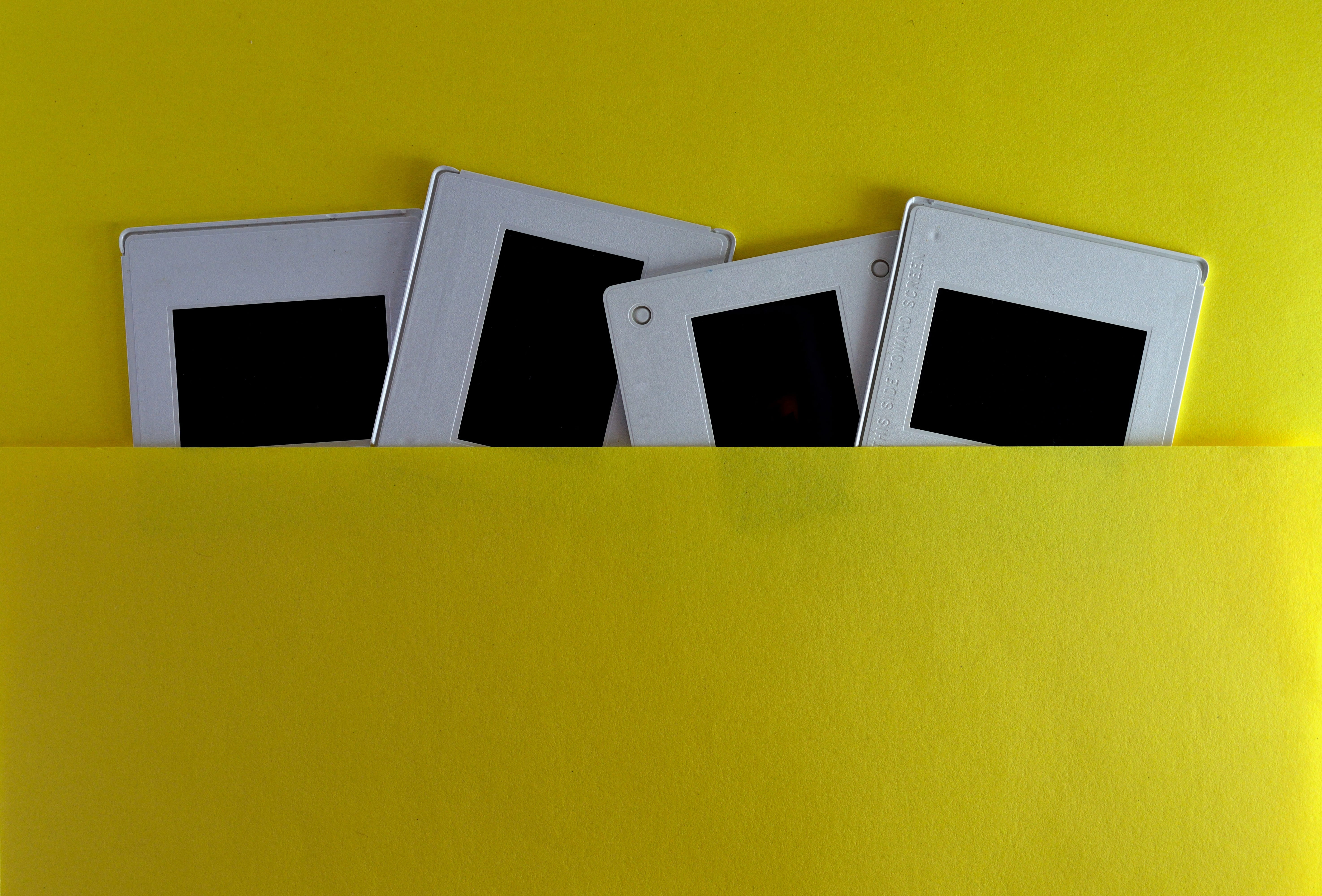 memories, medium group of objects, yellow background, communication, analog, 5K, vintage, reel, edges, photo, framework, negative, no people, window, black color, HD Wallpaper