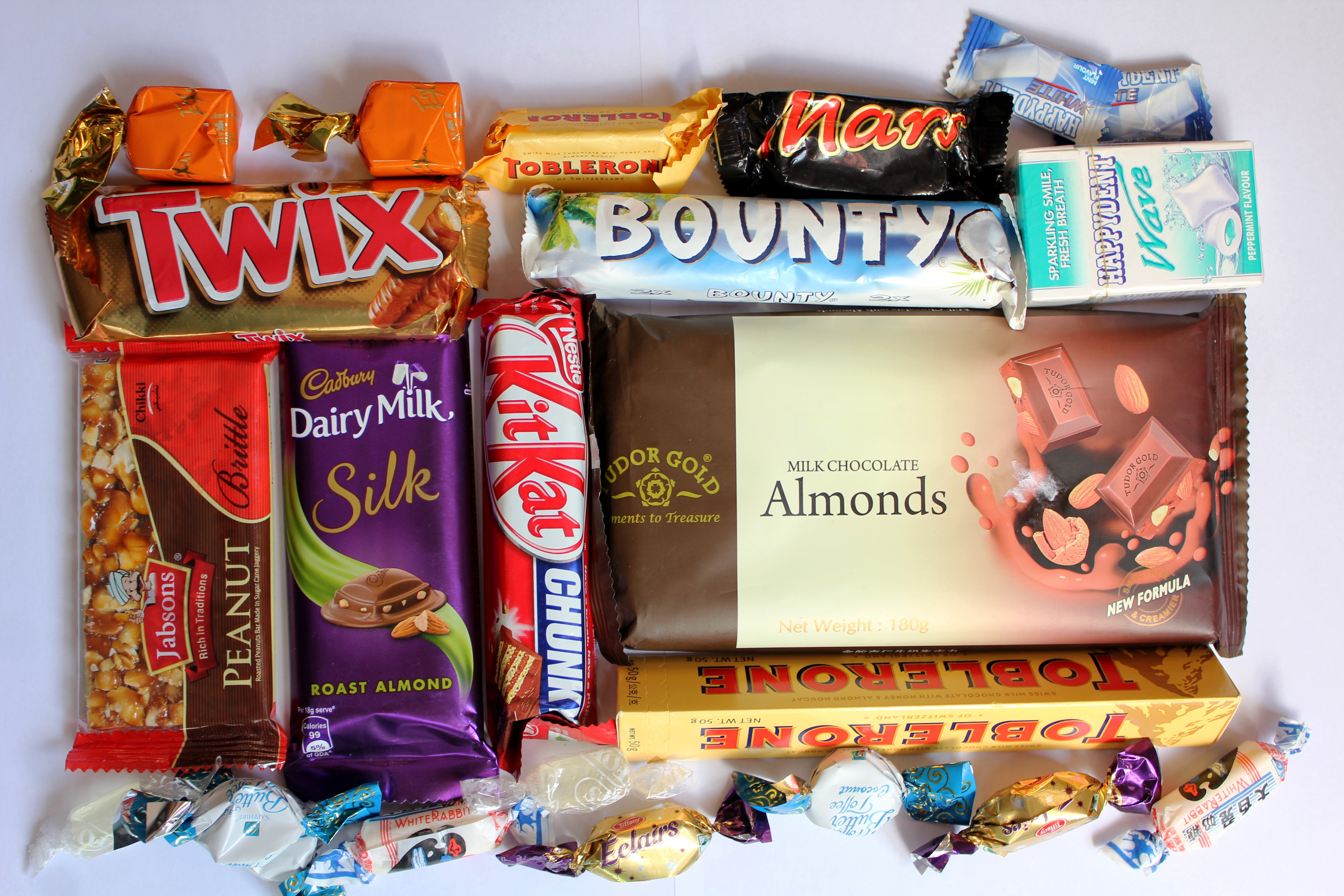 food and drink, dairy milk, arrangement, sweet, festival, box - container, multi colored, large group of objects, human representation, western script, HD Wallpaper