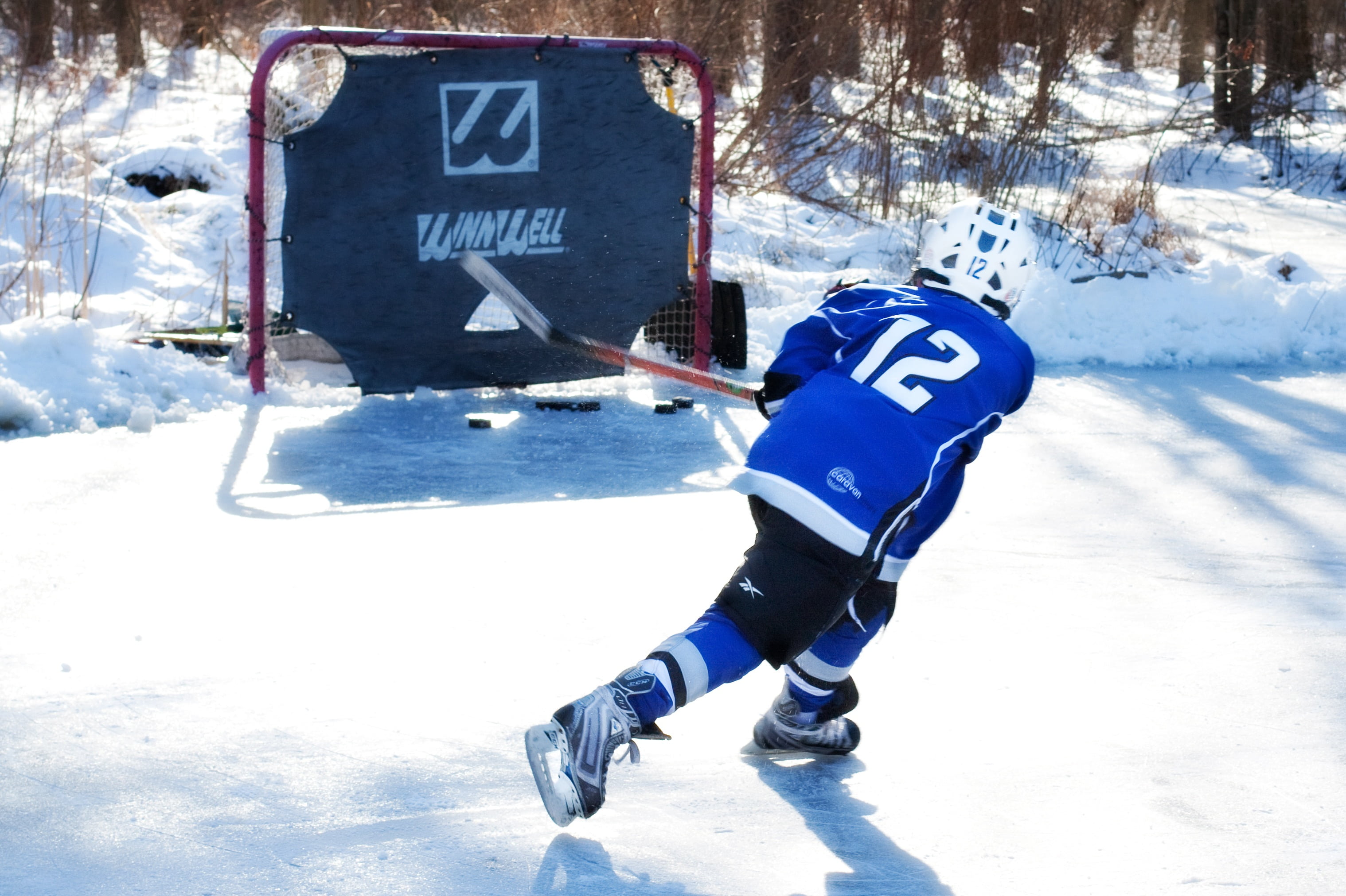 red, warm clothing, outdoor, sport, helmet, text, leisure activity, child, day, real people, sign, ice rink, hockey player, player, stick, ice hockey, cold temperature, HD Wallpaper