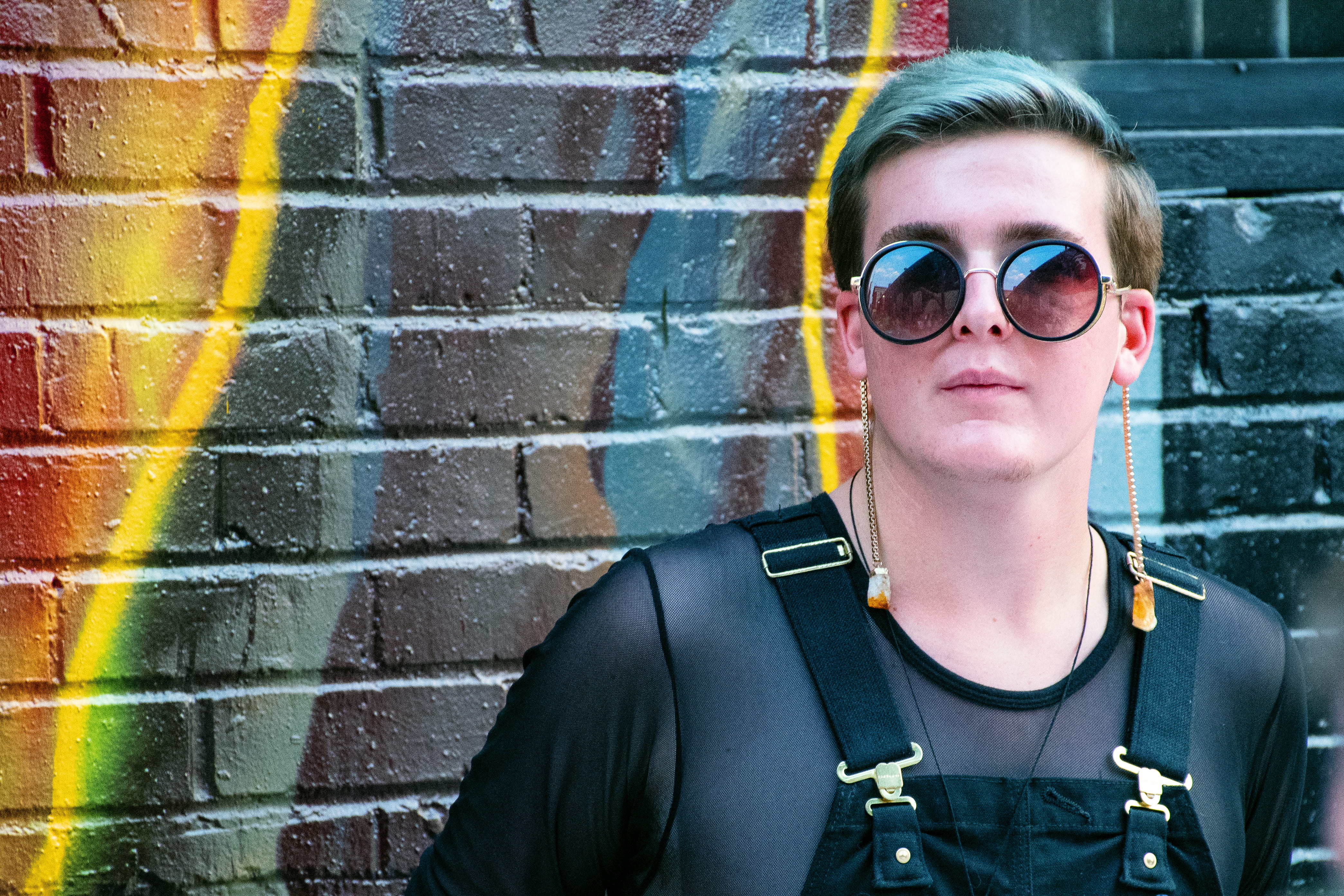 portrait, 4K, fashion, color, sunglasses, adult, wear, man, person, brick, pose, standing, model, real people, gray, near, wall - building feature, headshot, HD Wallpaper