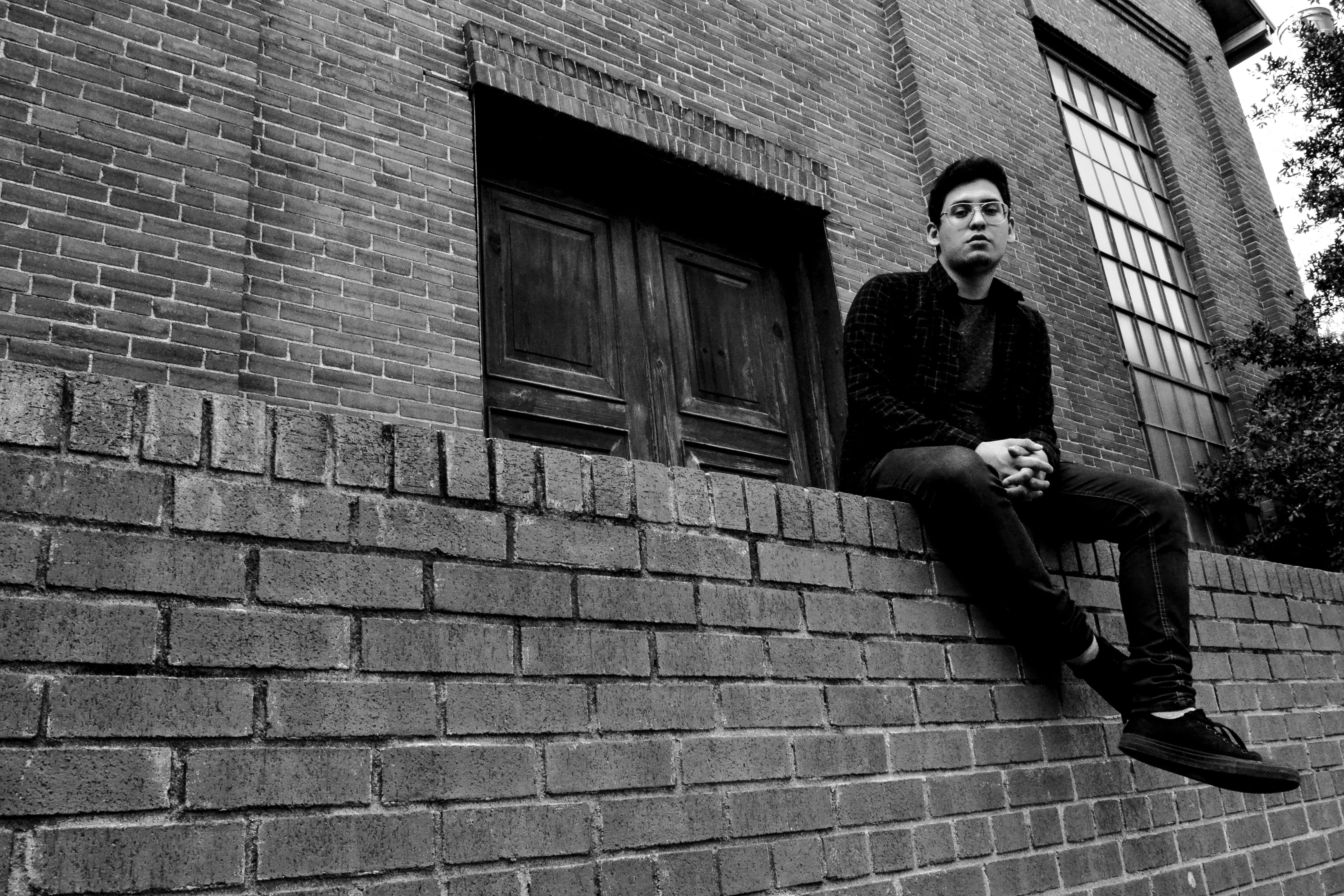 young adult, low angle shot, pose, black, men, portrait, person, photography, city, grayscale, young men, casual clothing, sad, front view, architecture, HD Wallpaper
