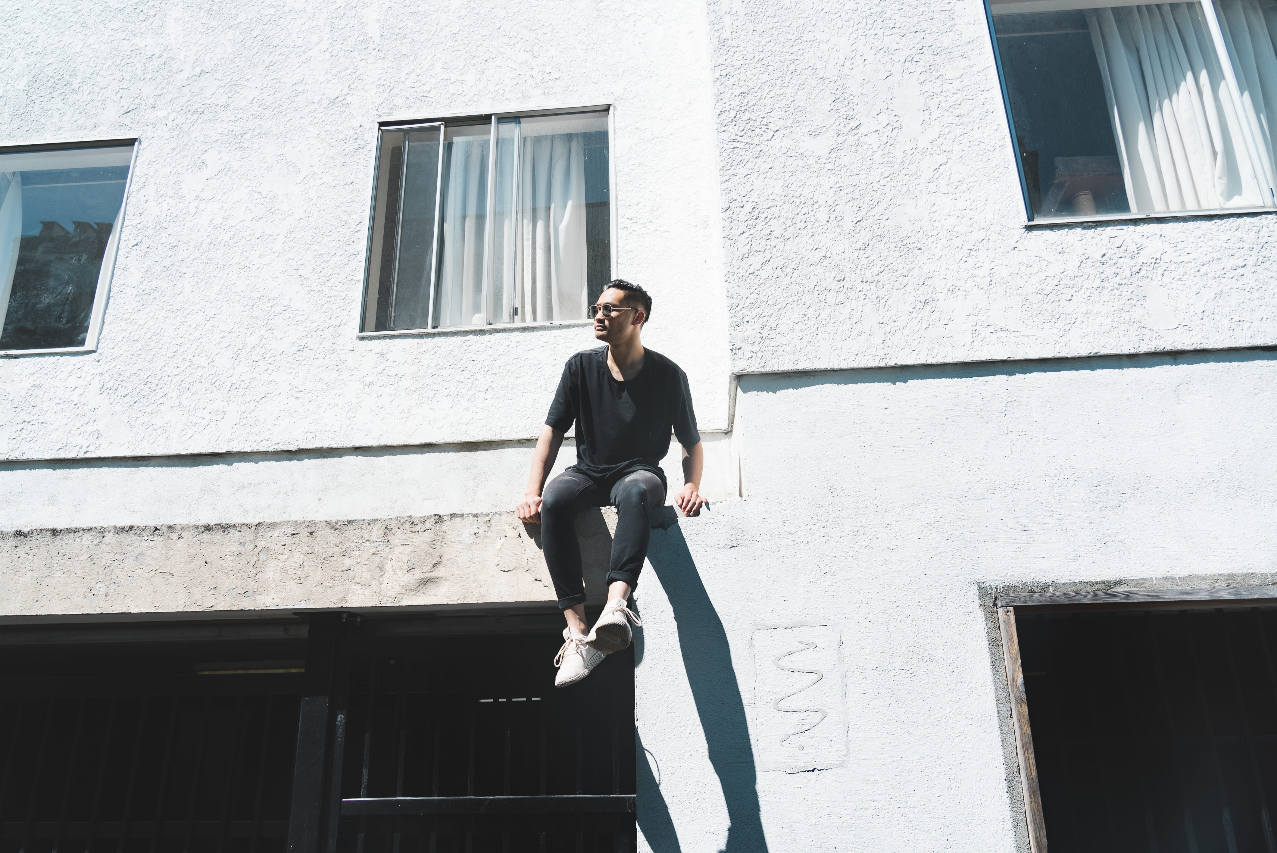sneaker, sitting, sunlight, street, fashion, leisure activity, sunglass, climb, 4K, city, low angle view, front view, man, real people, black, full length, HD Wallpaper