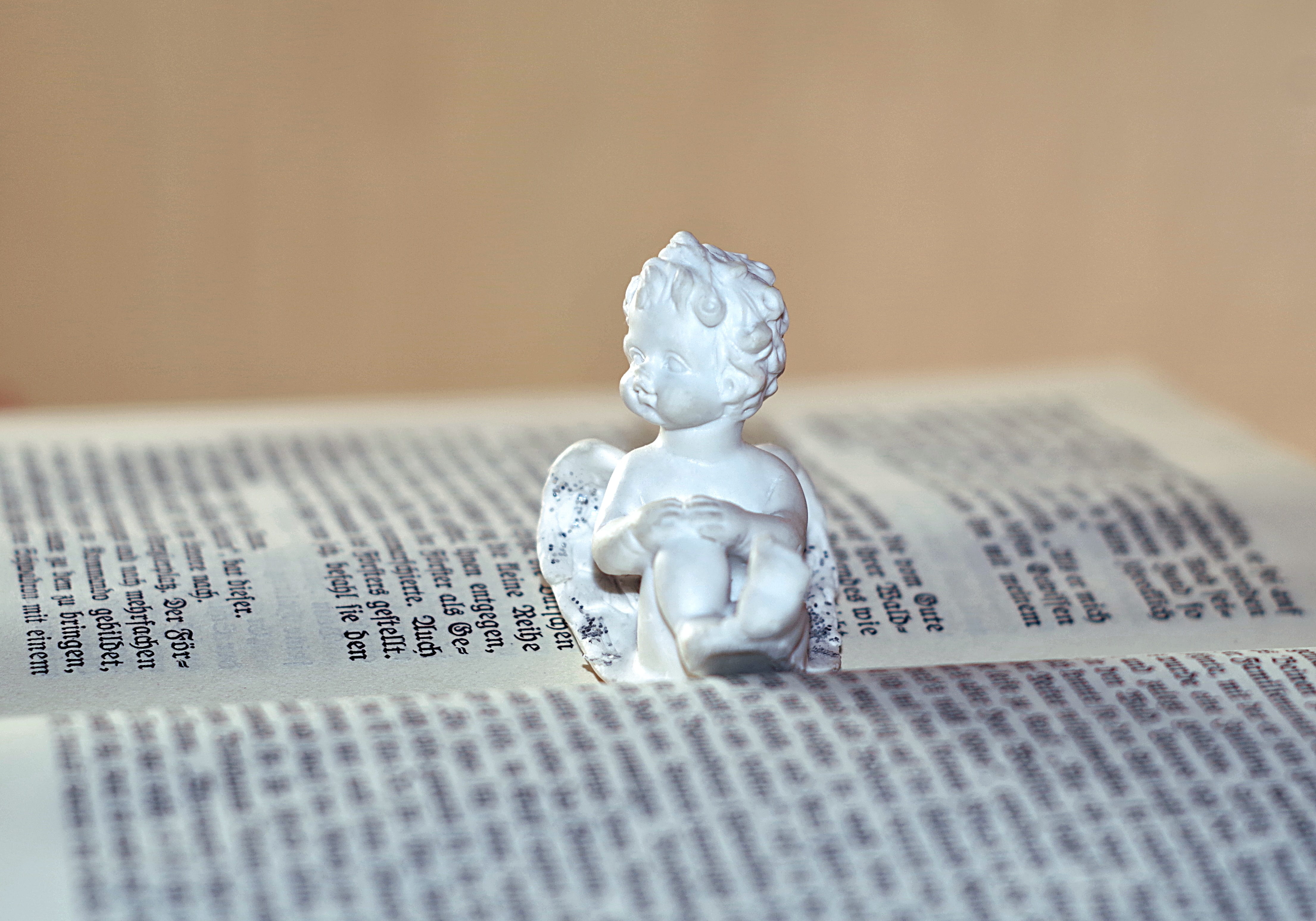 no people, book, innocence, decorative, relaxation, joy, german, paper, statue, toy, indoors, ornament, old text, close-up, the passion of the christ, expense, HD Wallpaper