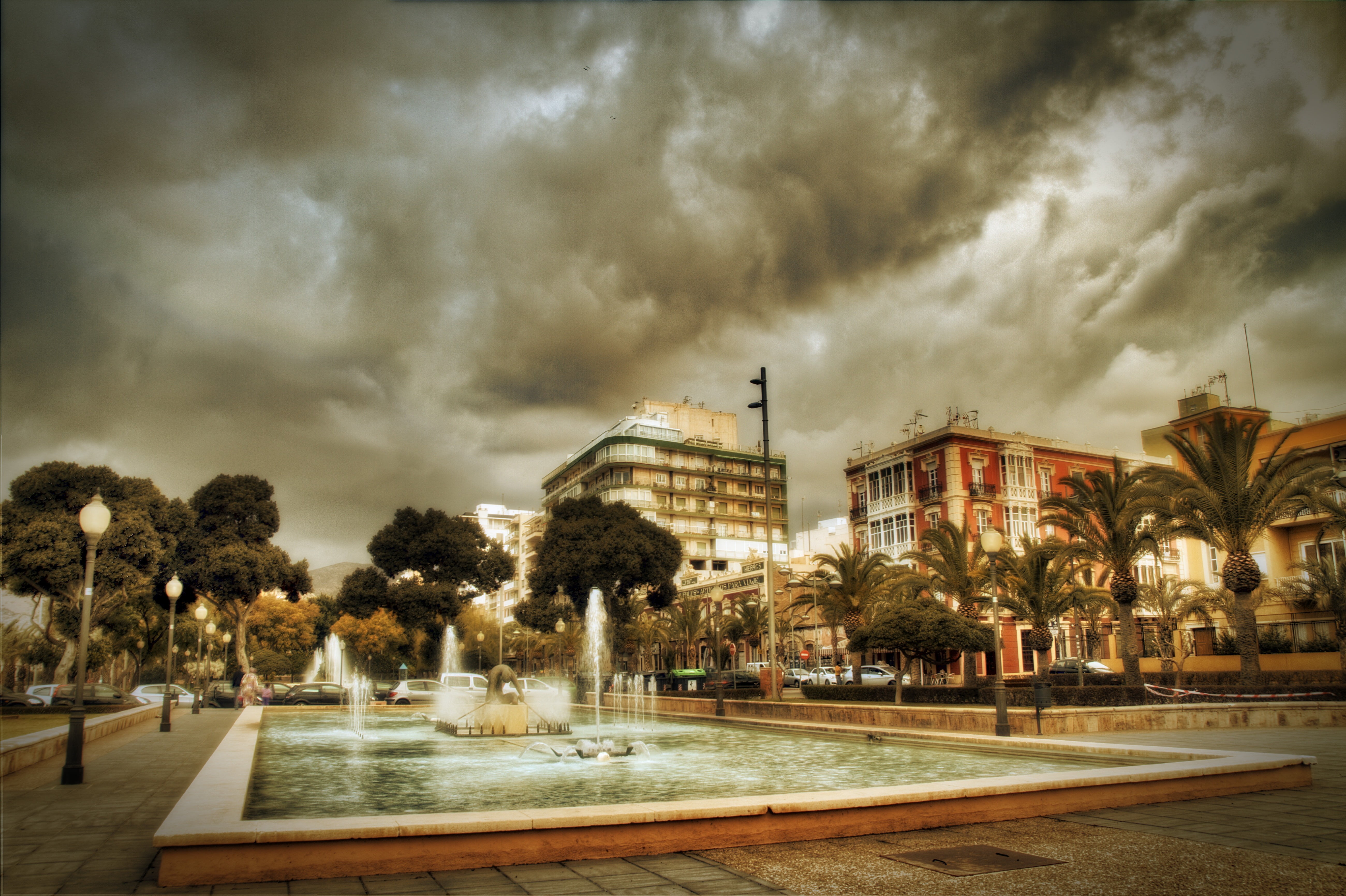 transportation, wet, built structure, cloud - sky, almeria, rain, plant, no people, nature, architecture, overcast, water, road, fountain pond, tree, outdoors, HD Wallpaper