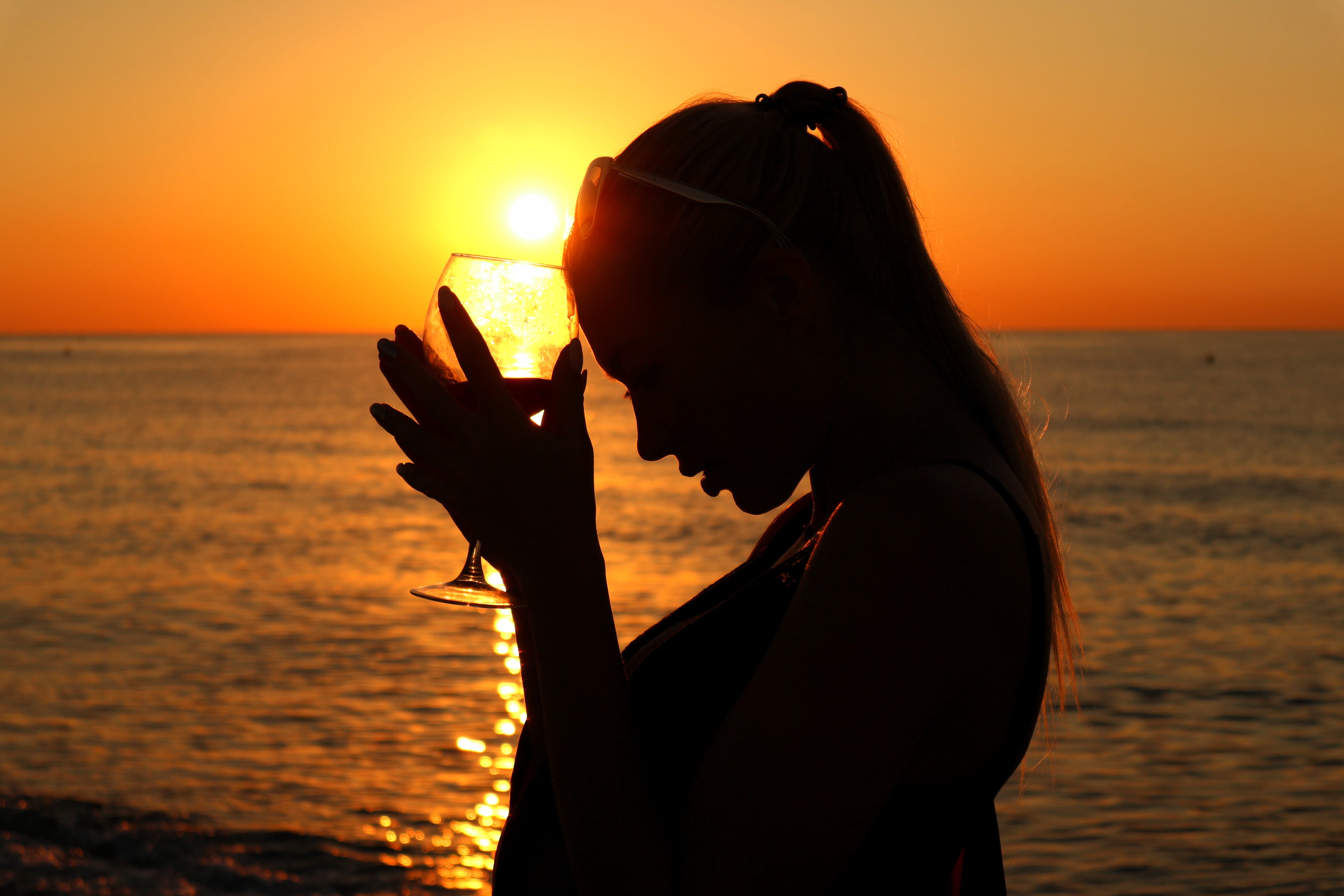 drinking, wine, orange color, 5K, sun, profile view, young adult, silhouette, nature, pavelló de la mar bella, adult, spain, silouette, leisure activity, HD Wallpaper