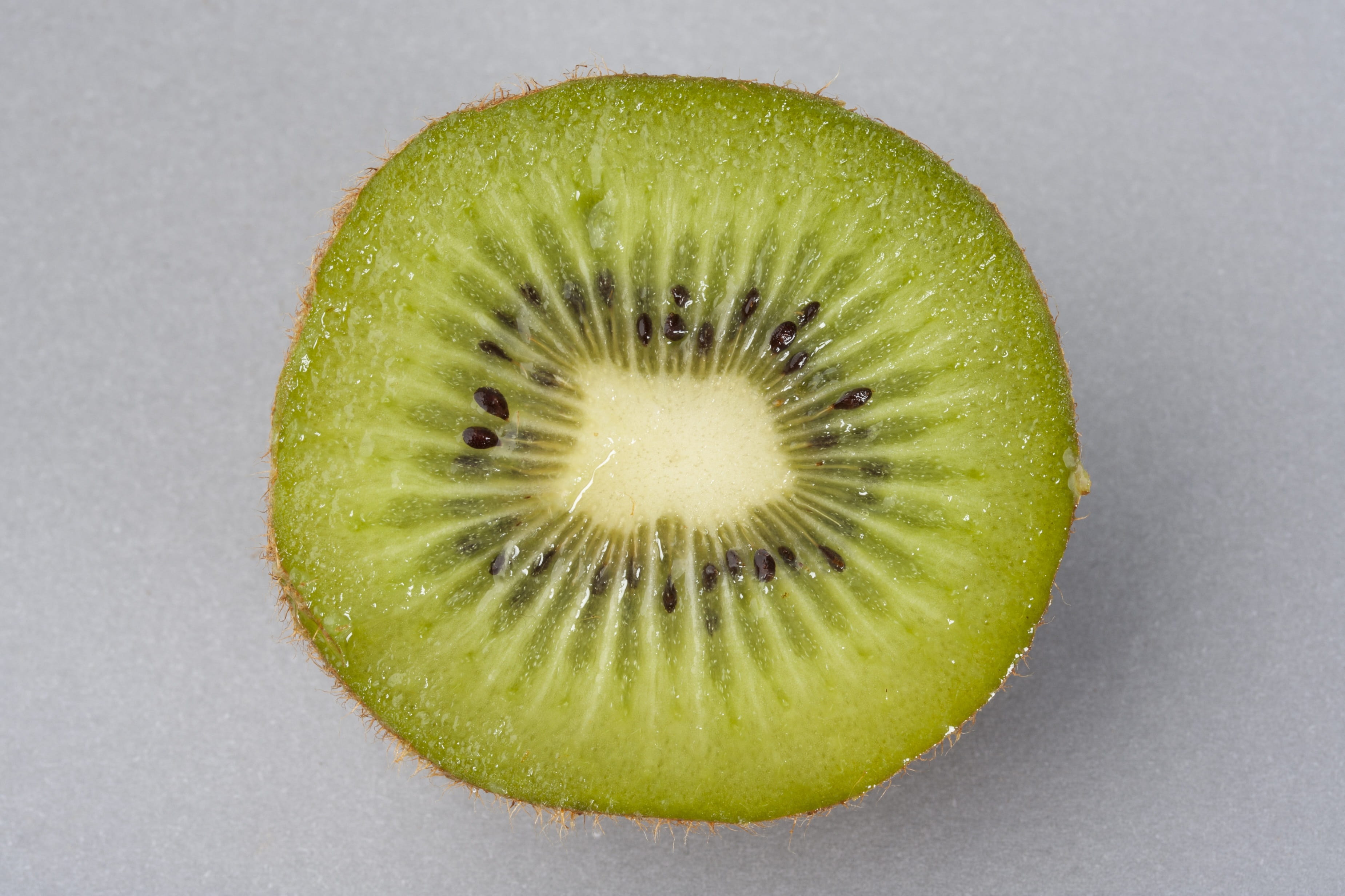 macro, Diet, gray, Studio, sliced, no people, gray background, health, close-up, green color, Beautiful, 2K, kiwi - fruit, freshness, fruit, kiwi, ripe, HD Wallpaper