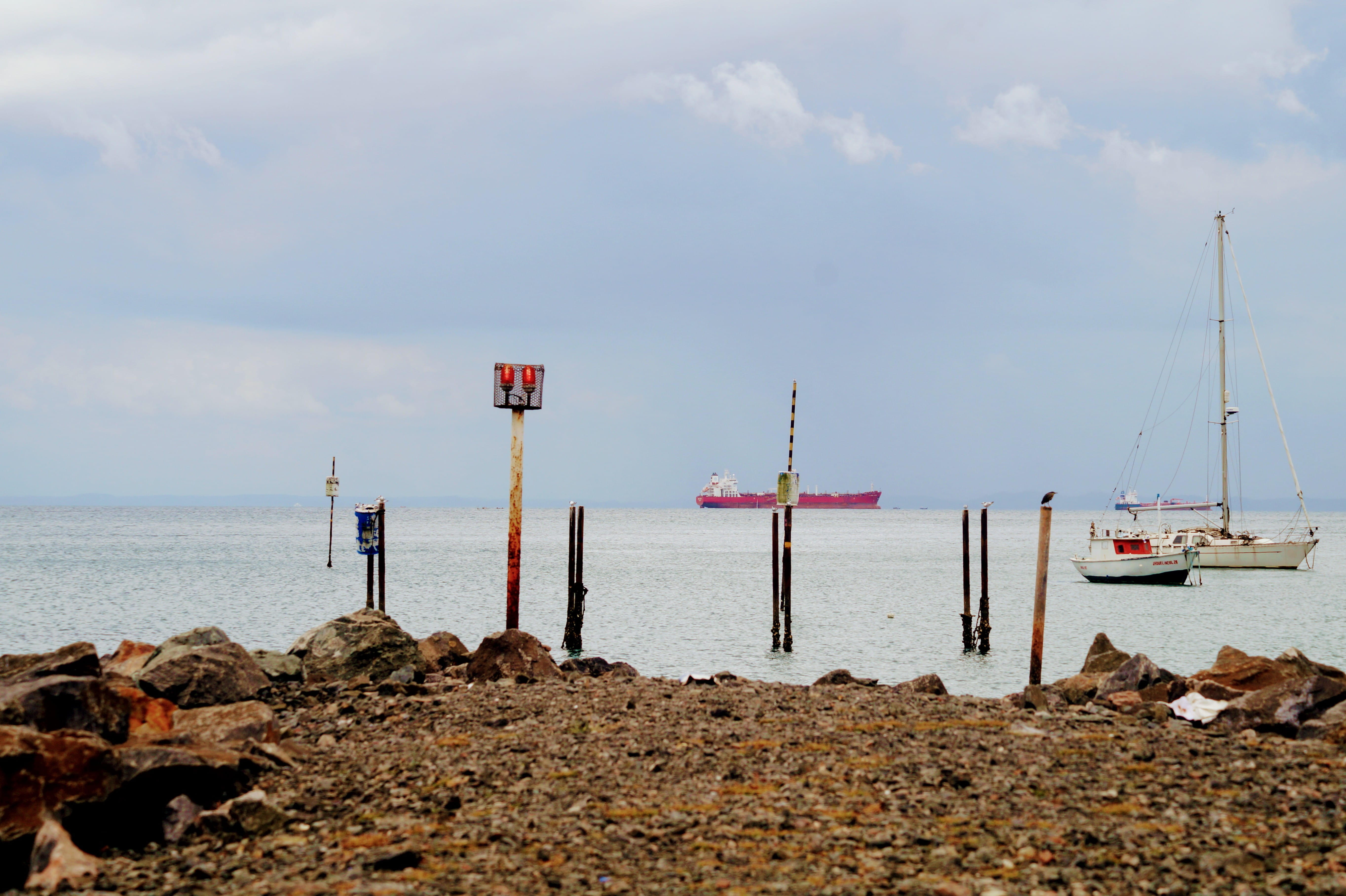 pole, no people, ship, day, sailboat, land, landing stage, tranquility, scenics - nature, rock - object, ocean, harbor, solid, sea, tanker, port, guiding lights, HD Wallpaper