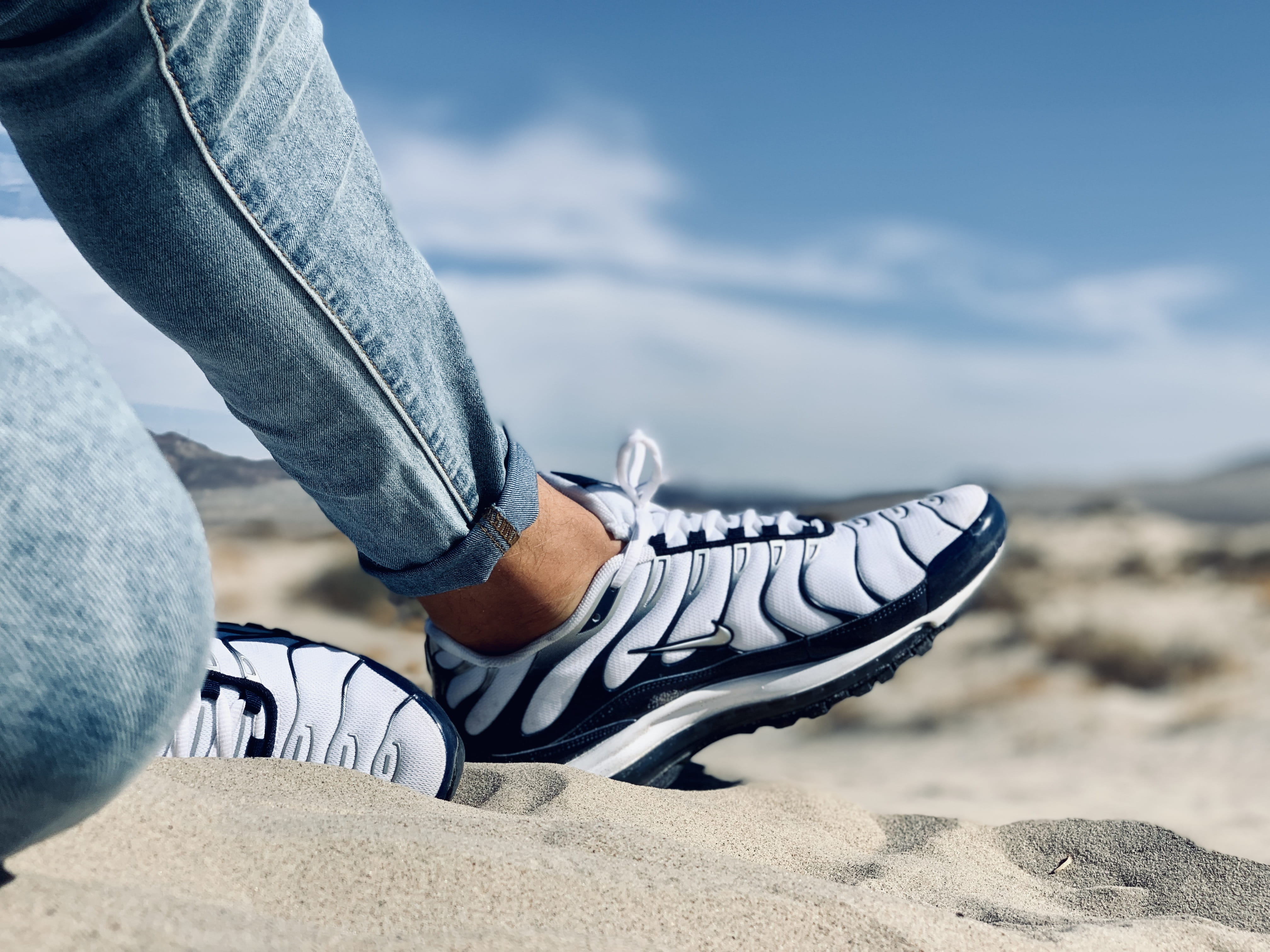 focus on foreground, jeans, 4K, sneakers, lifestyles, unrecognizable person, sky, shoes, human foot, outdoors, leisure, white, shoe, recreation, footwear, HD Wallpaper