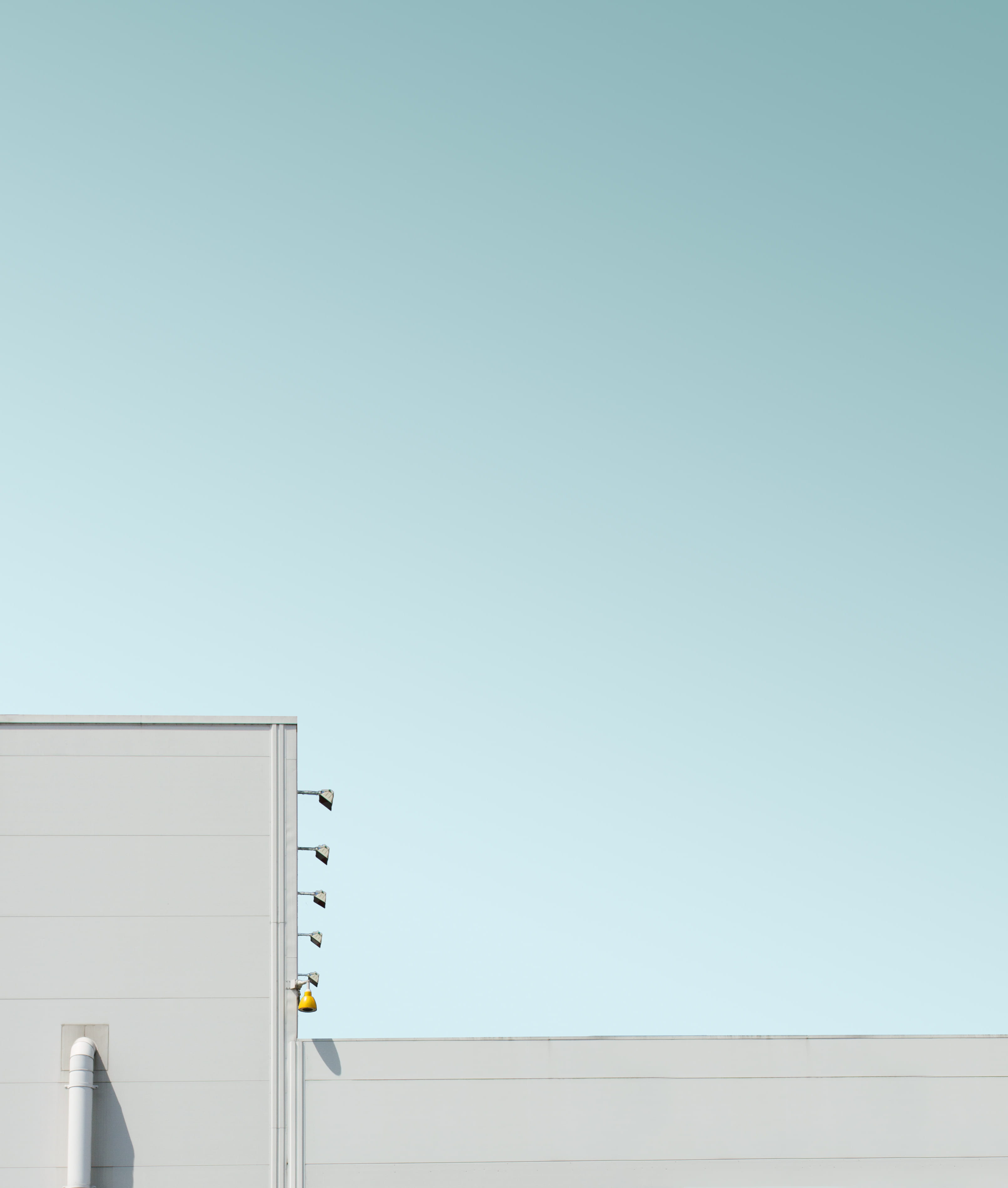 negative space, sunlight, low angle view, blue sky, geometric, clear sky, business, facade, urban, front, sky, corner, untitled, minimalism, communication, Phone HD Wallpaper